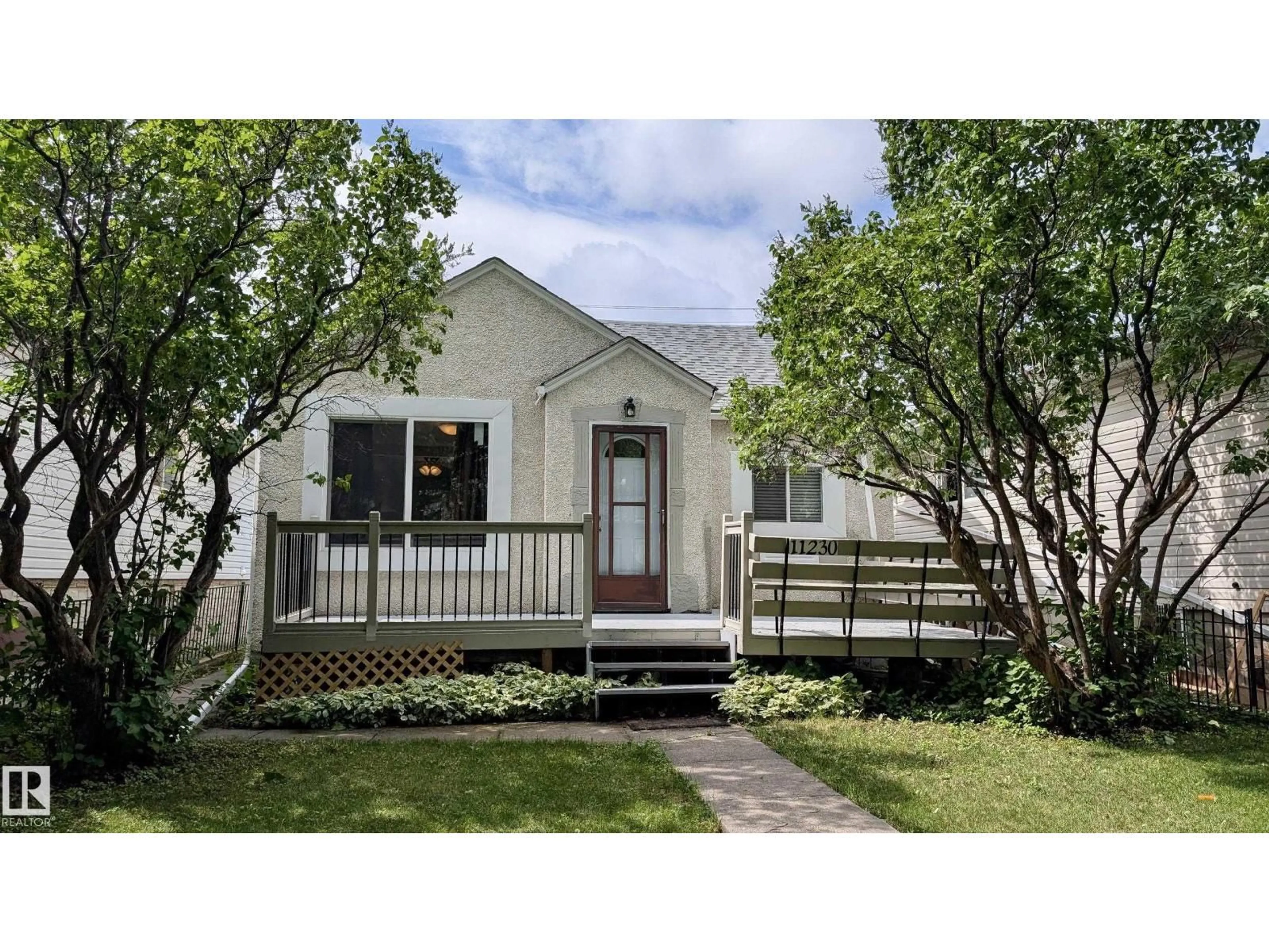 Home with vinyl exterior material, street for 11230 84 ST, Edmonton Alberta T5B3A9