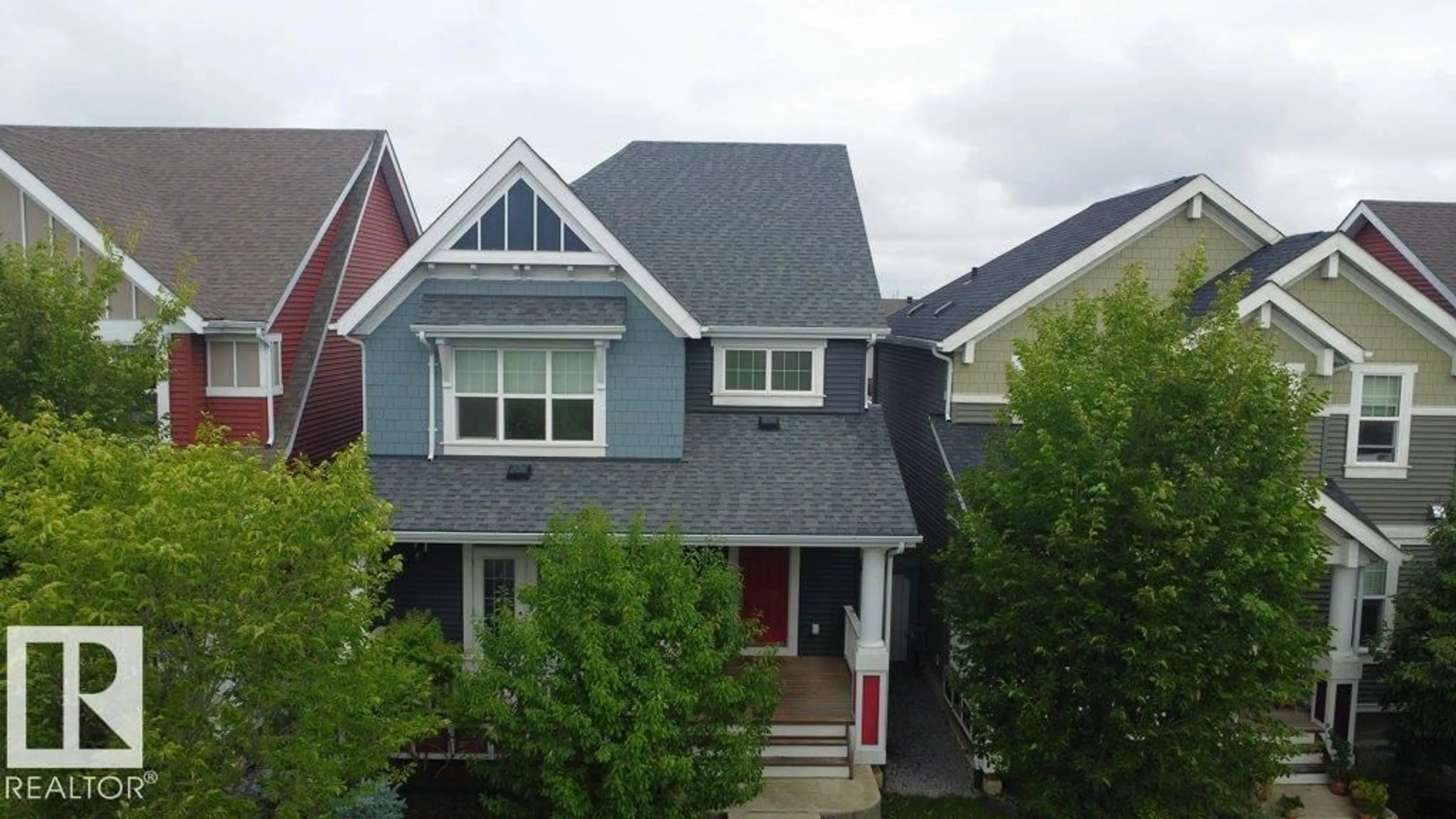 Home with vinyl exterior material, street for 7108 SUMMERSIDE GRANDE BV, Edmonton Alberta T6X2E7