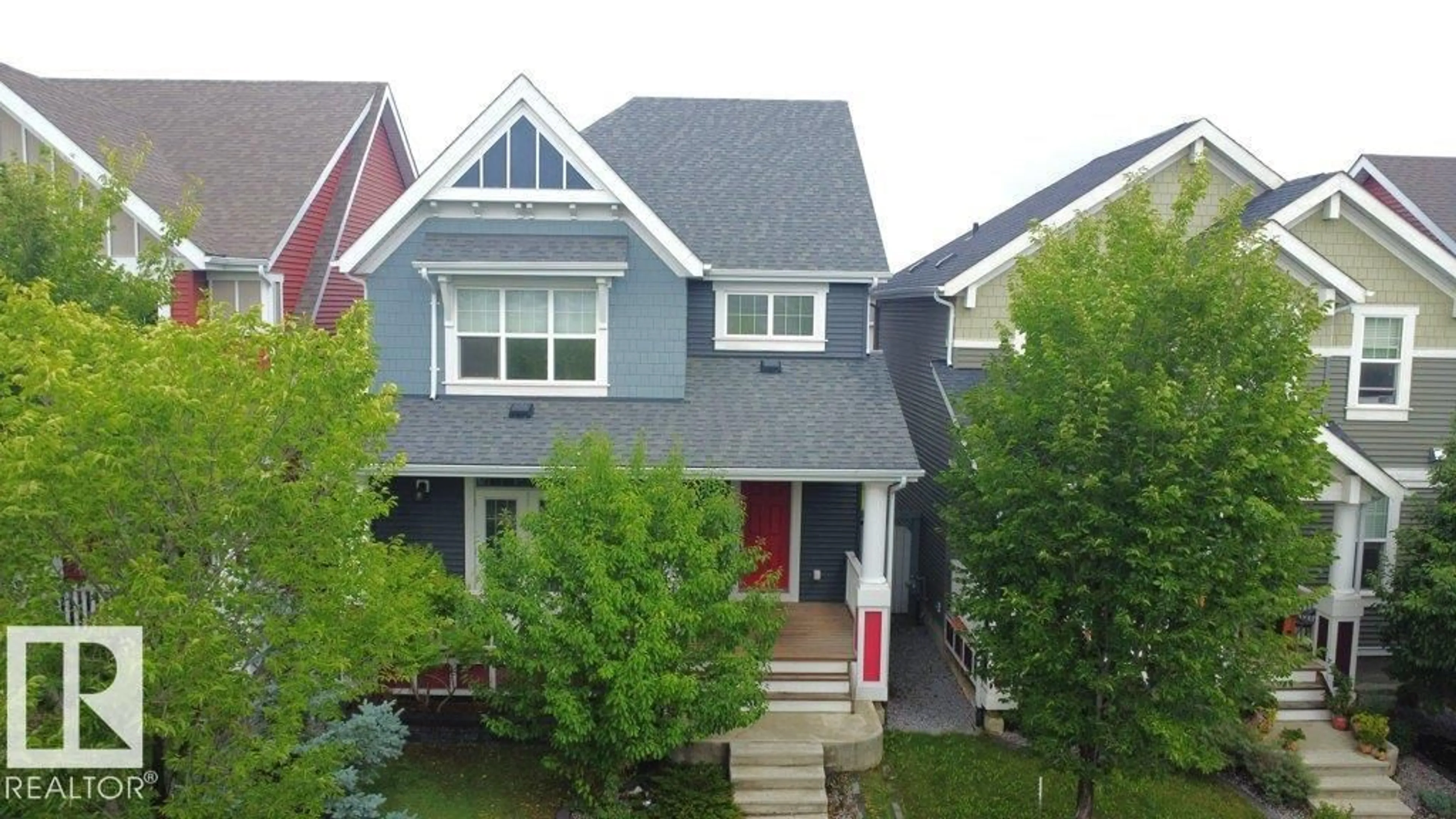 Home with vinyl exterior material, street for 7108 SUMMERSIDE GRANDE BV, Edmonton Alberta T6X2E7