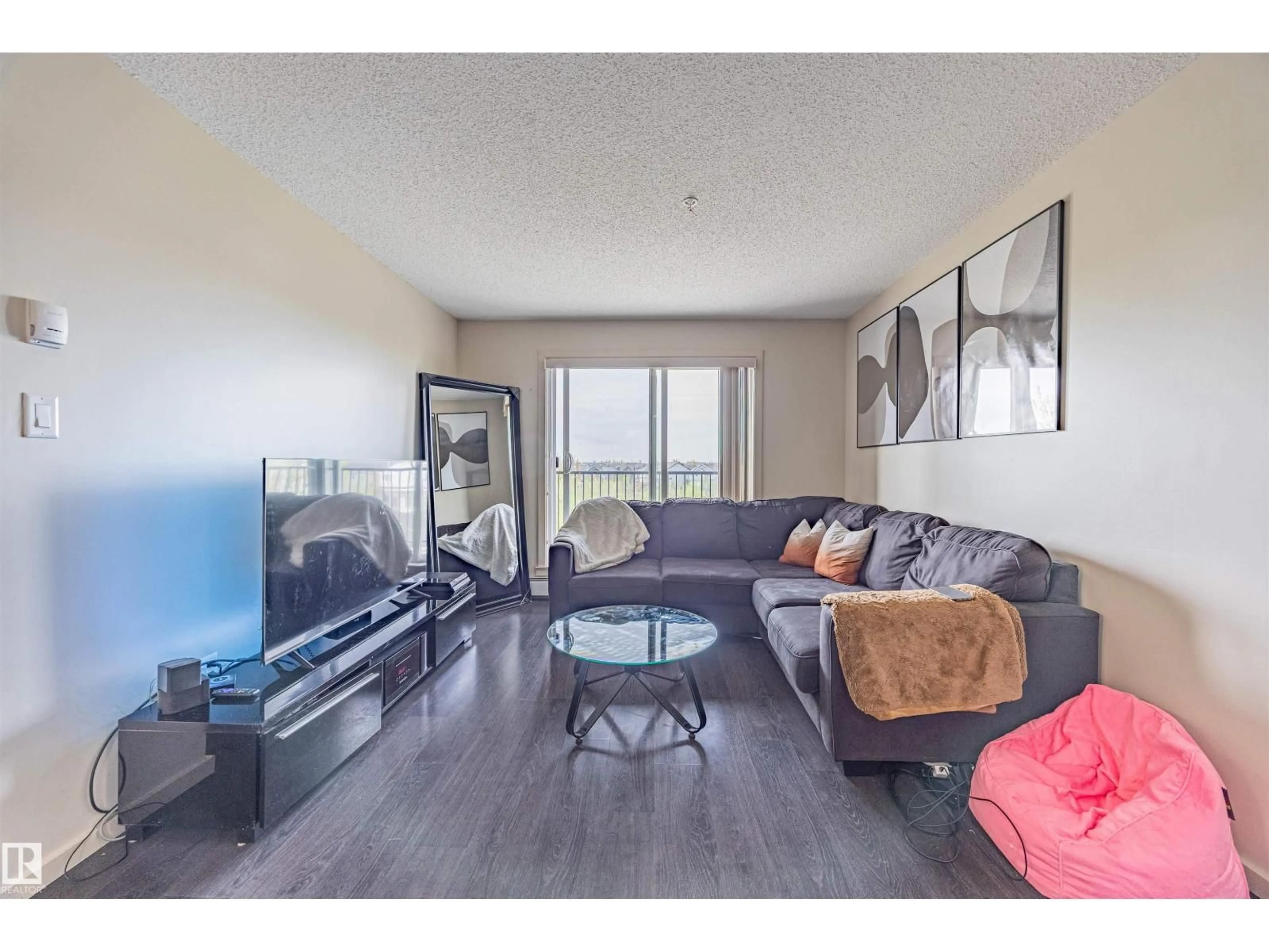 Living room with furniture, unknown for 504 - 329 ALBANY WY, Edmonton Alberta T6V0L2