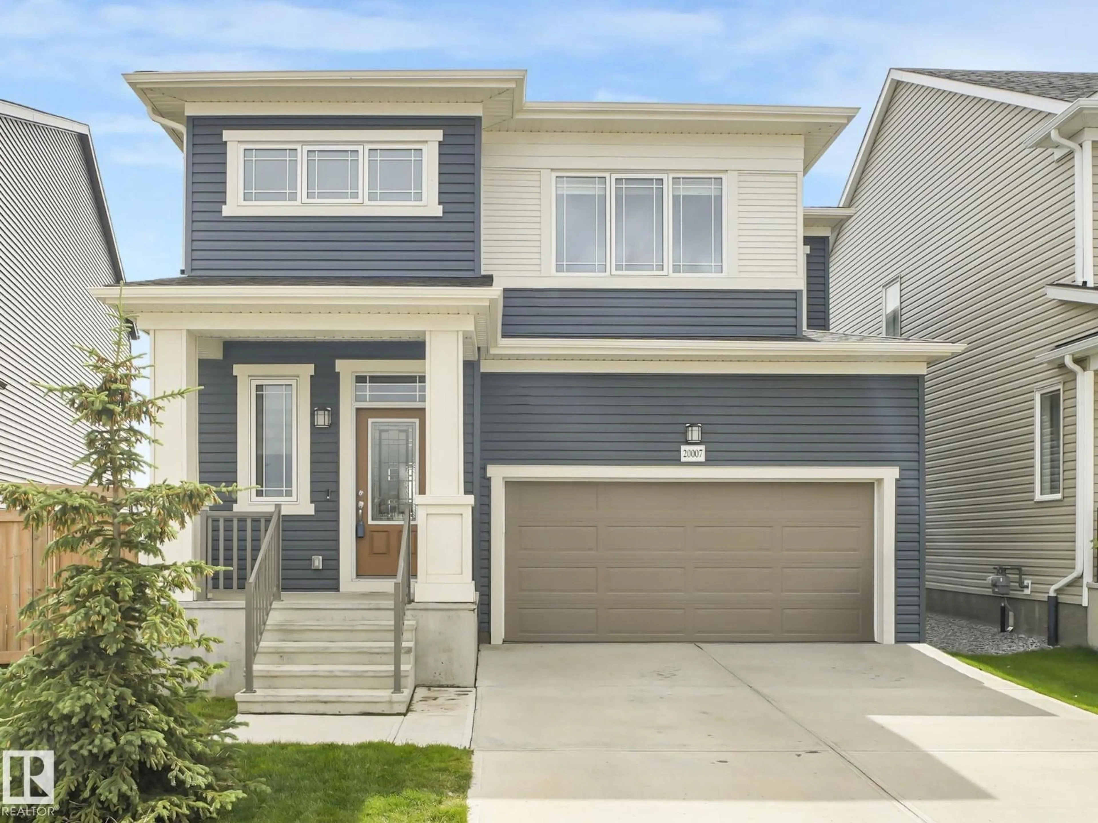 Home with vinyl exterior material, street for NW - 20007 15 AV, Edmonton Alberta T6M1L6
