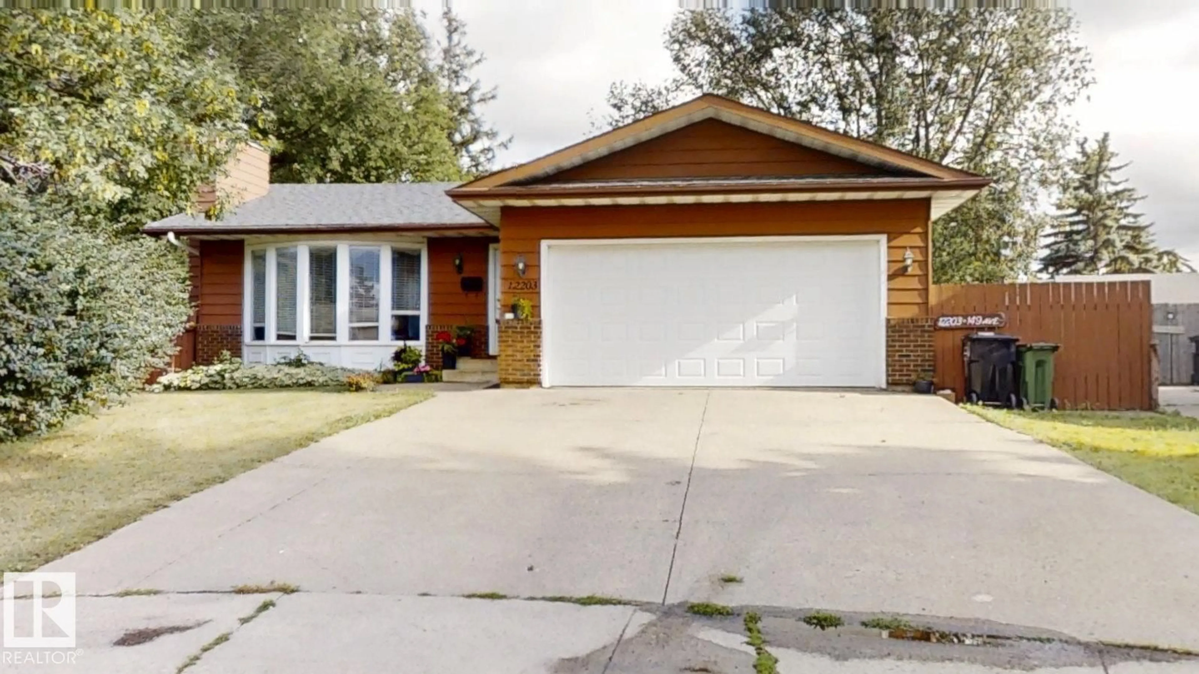 Home with brick exterior material, street for 12203 149 AV, Edmonton Alberta T5X2E1