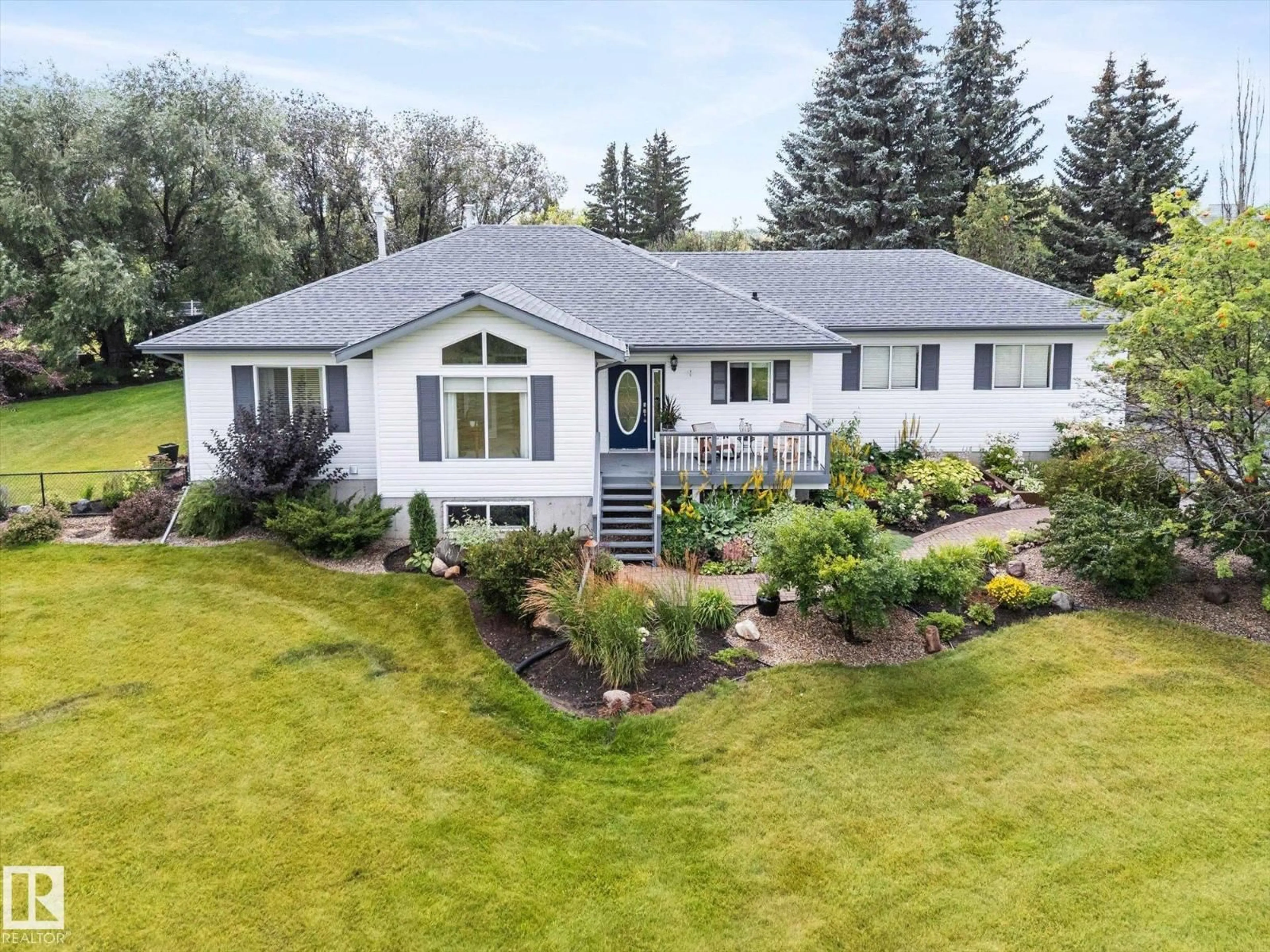 A pic from outside/outdoor area/front of a property/back of a property/a pic from drone, unknown for 14 - 14 RGE ROAD 15, Rural Parkland County Alberta T7Y0C3