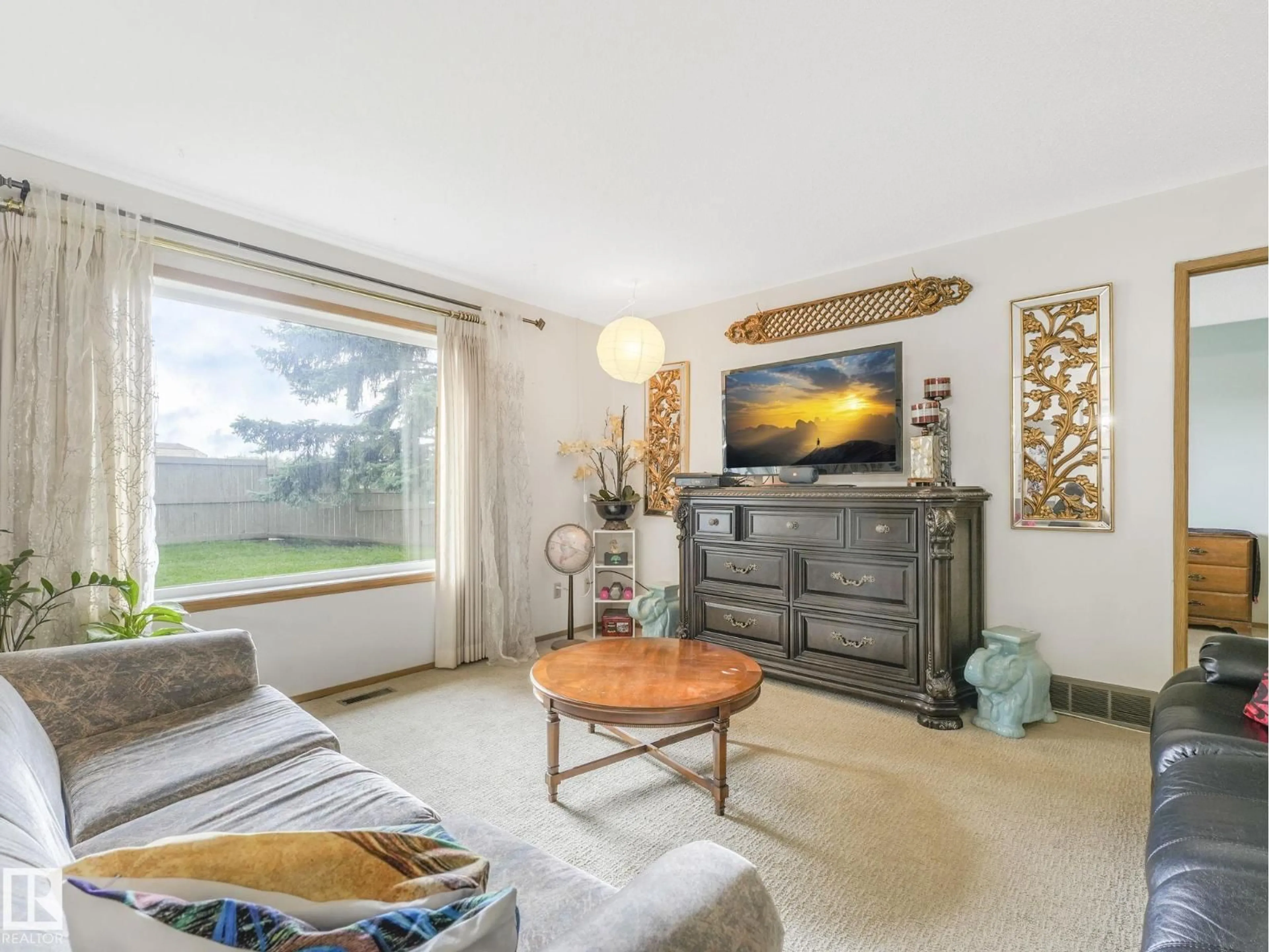 Living room with furniture, wood/laminate floor for 17210 CALLINGWOOD RD, Edmonton Alberta T5T5P1