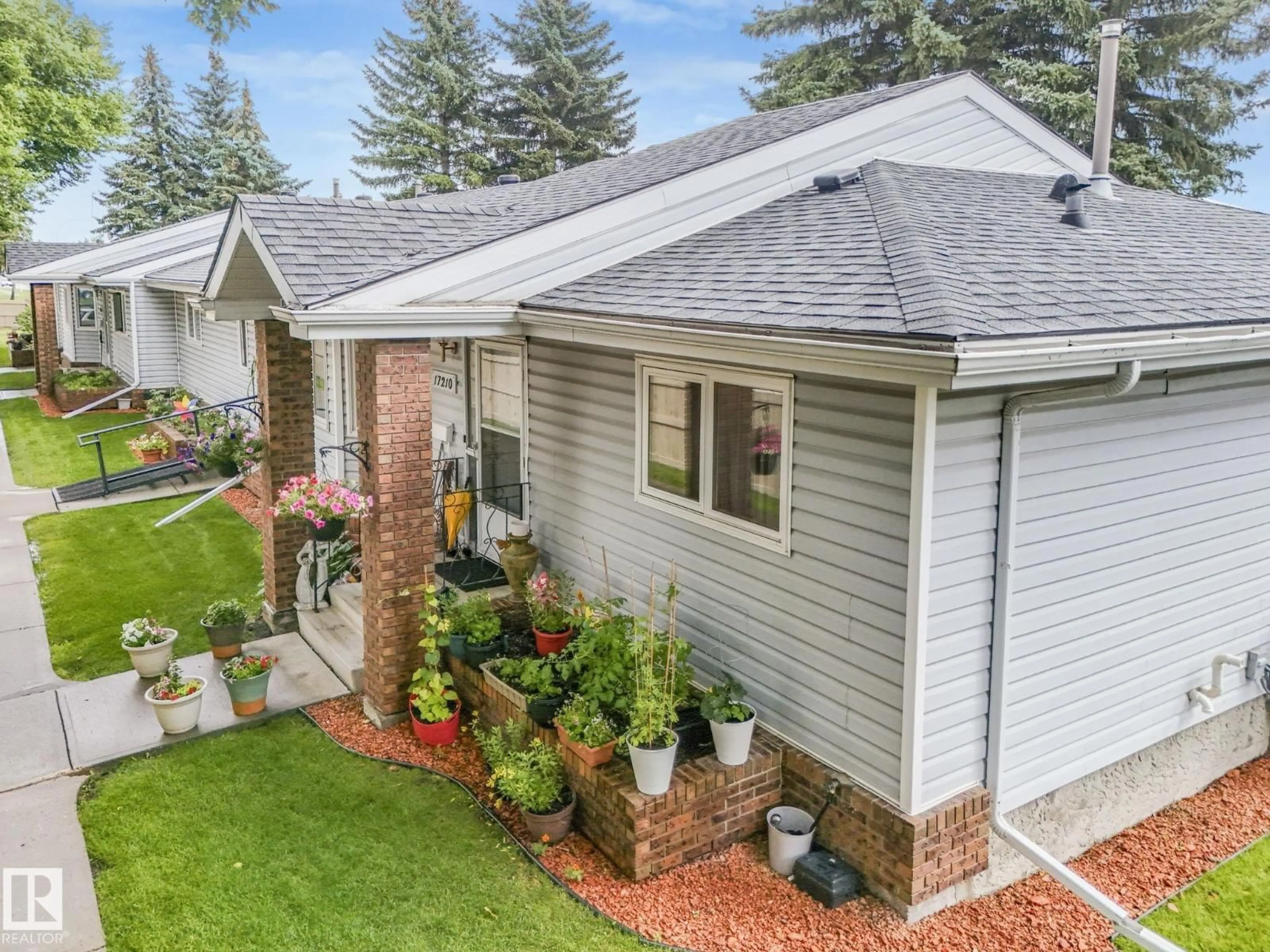 Home with vinyl exterior material, street for 17210 CALLINGWOOD RD, Edmonton Alberta T5T5P1