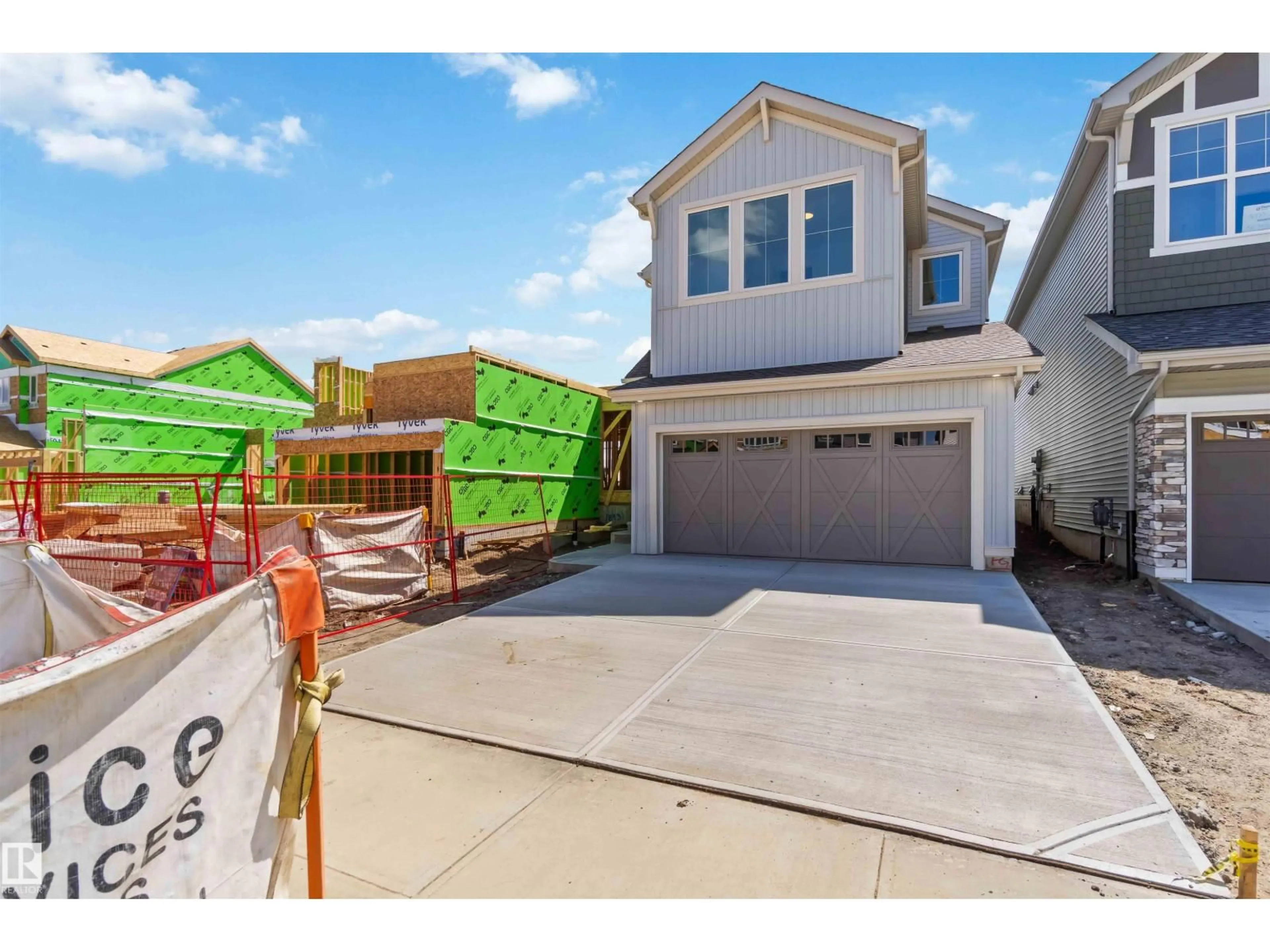 Home with vinyl exterior material, street for NW - 18935 28 AV, Edmonton Alberta T6M3H9