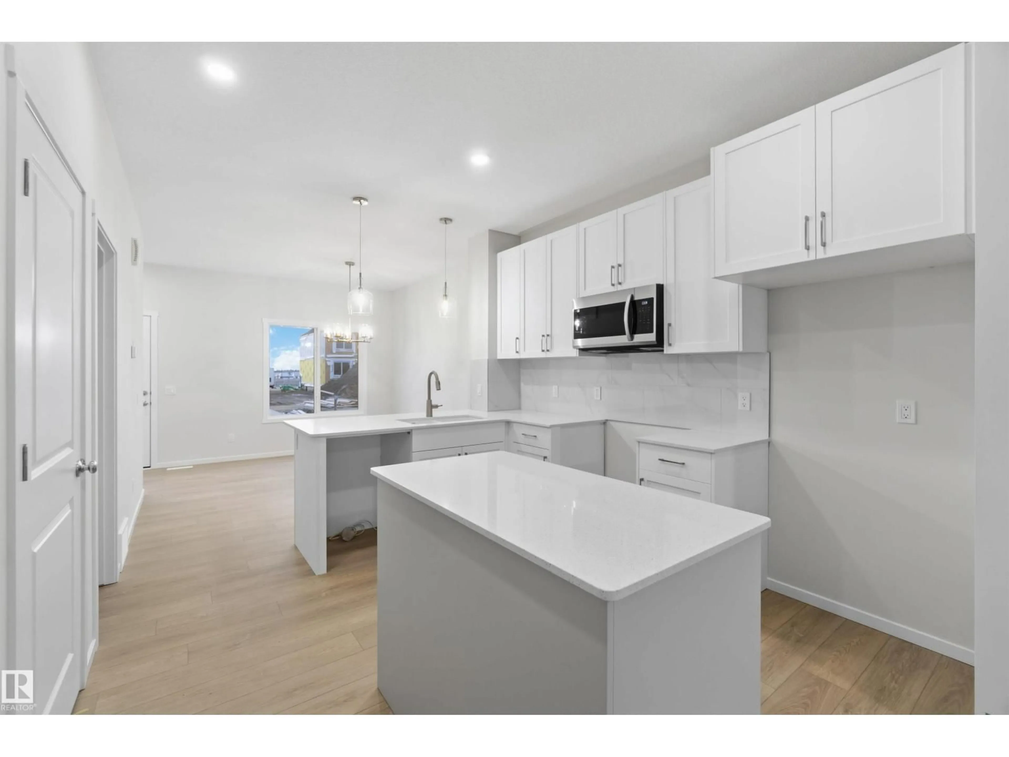 Open concept kitchen, unknown for 9083 ELVES LO, Edmonton Alberta T6M3G4