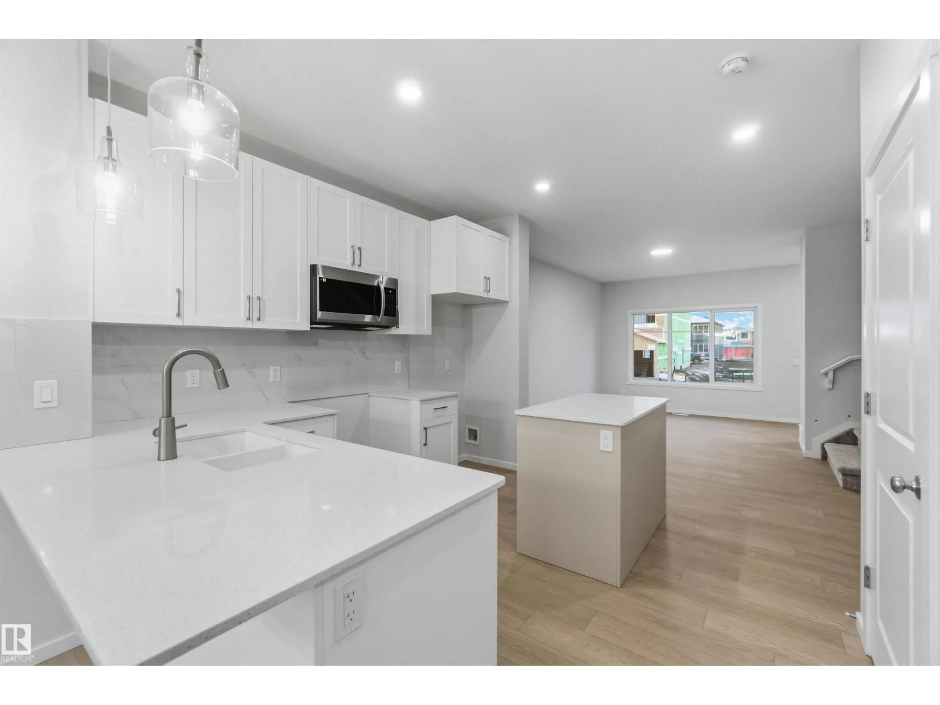 Open concept kitchen, ceramic/tile floor for 9083 ELVES LO, Edmonton Alberta T6M3G4