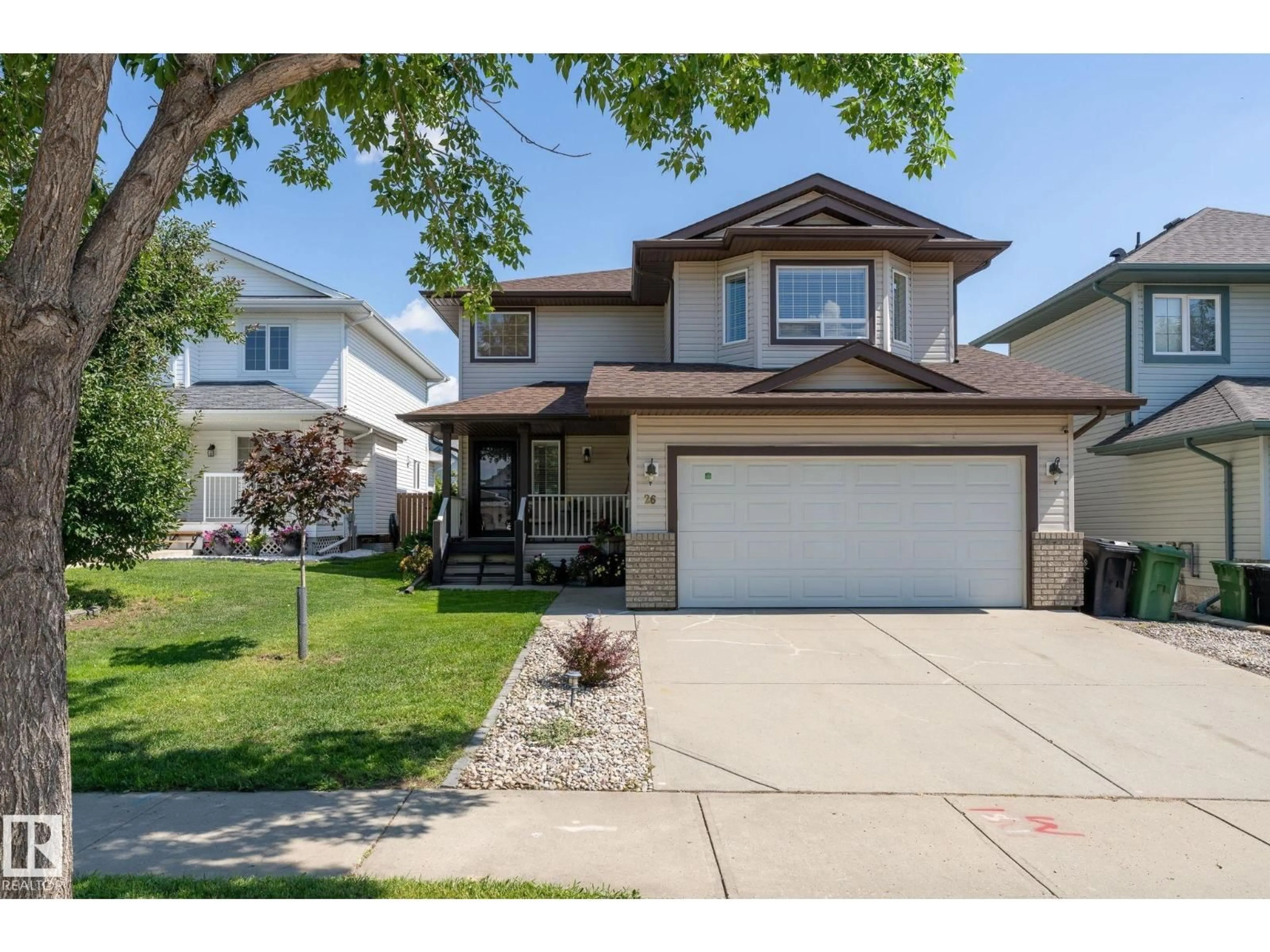 Home with vinyl exterior material, street for 26 WOODBEND WY, Fort Saskatchewan Alberta T8L4L8