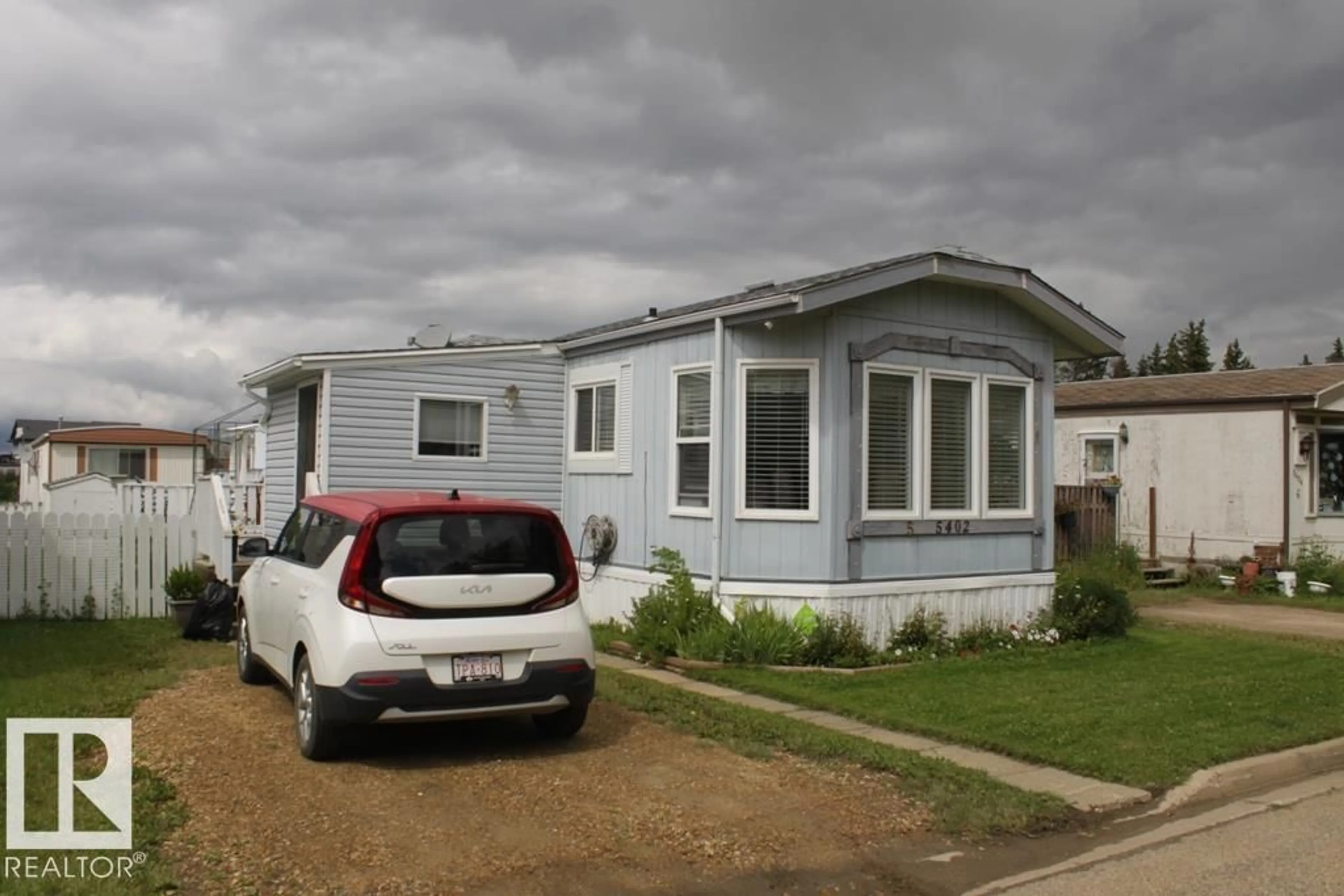 Home with vinyl exterior material, street for 5402 52 ST, Tofield Alberta T0B4J0