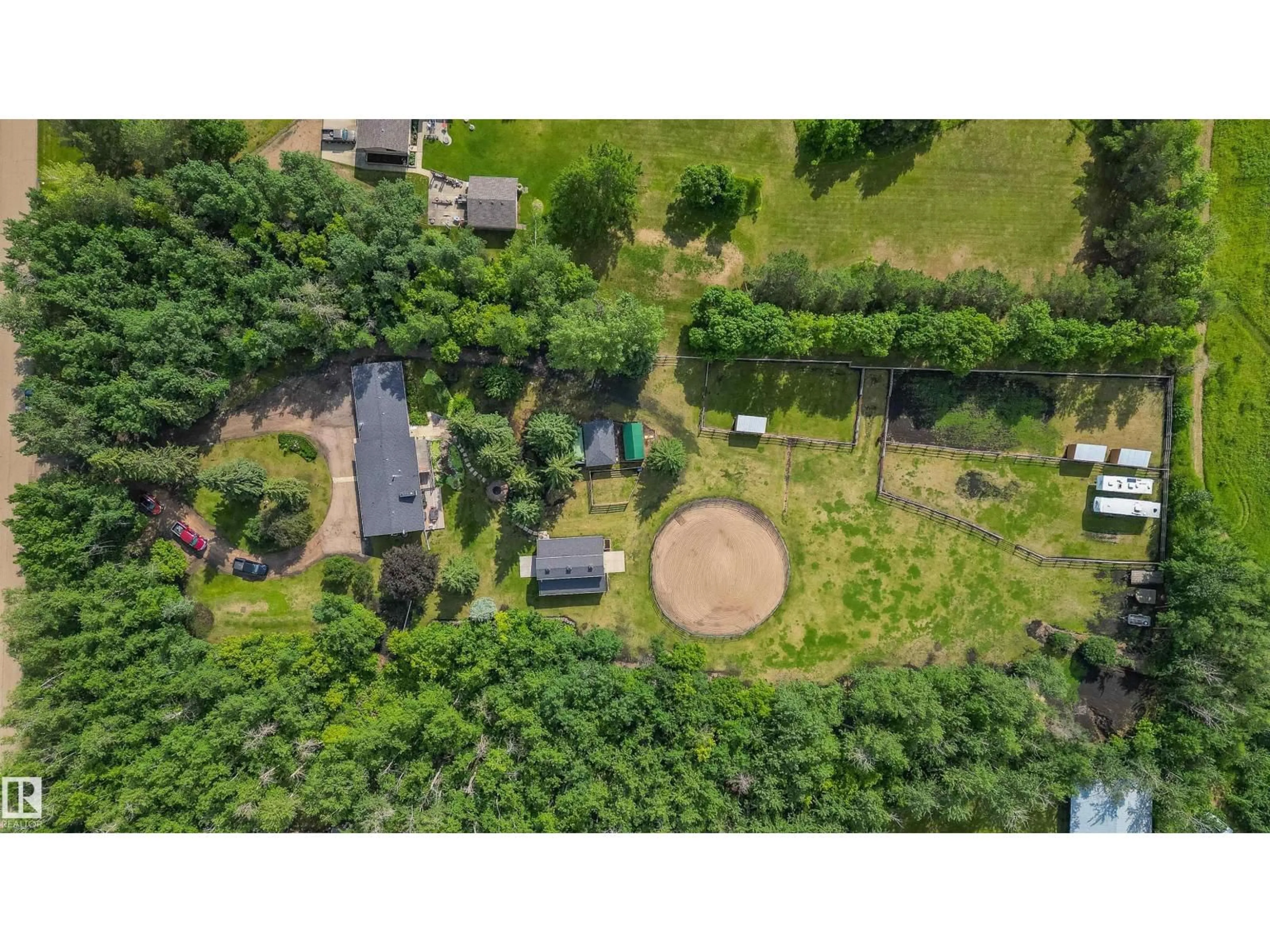 A pic from outside/outdoor area/front of a property/back of a property/a pic from drone, forest/trees view for 37 - 53059 RGE ROAD 224, Rural Strathcona County Alberta T8E2K4