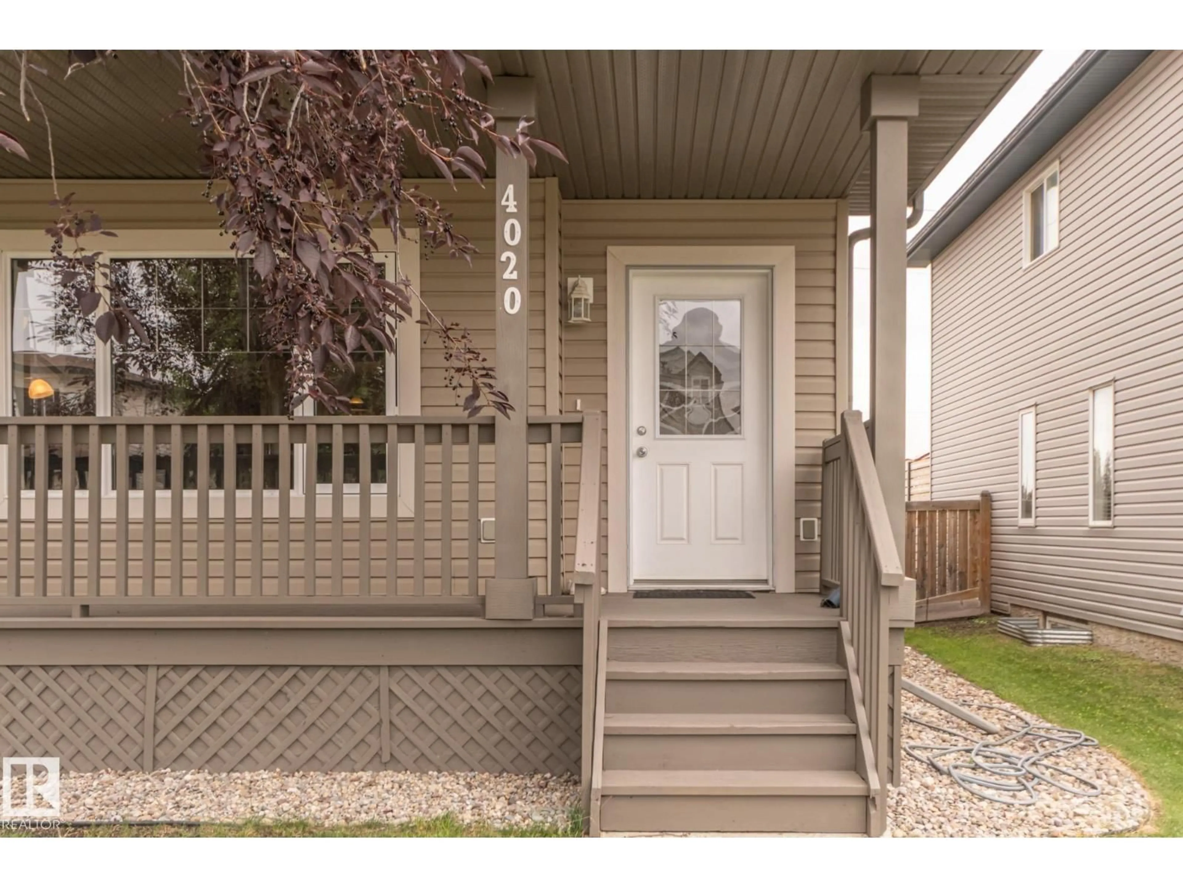 Home with vinyl exterior material, street for 4020 158 AV, Edmonton Alberta T5Y0A3