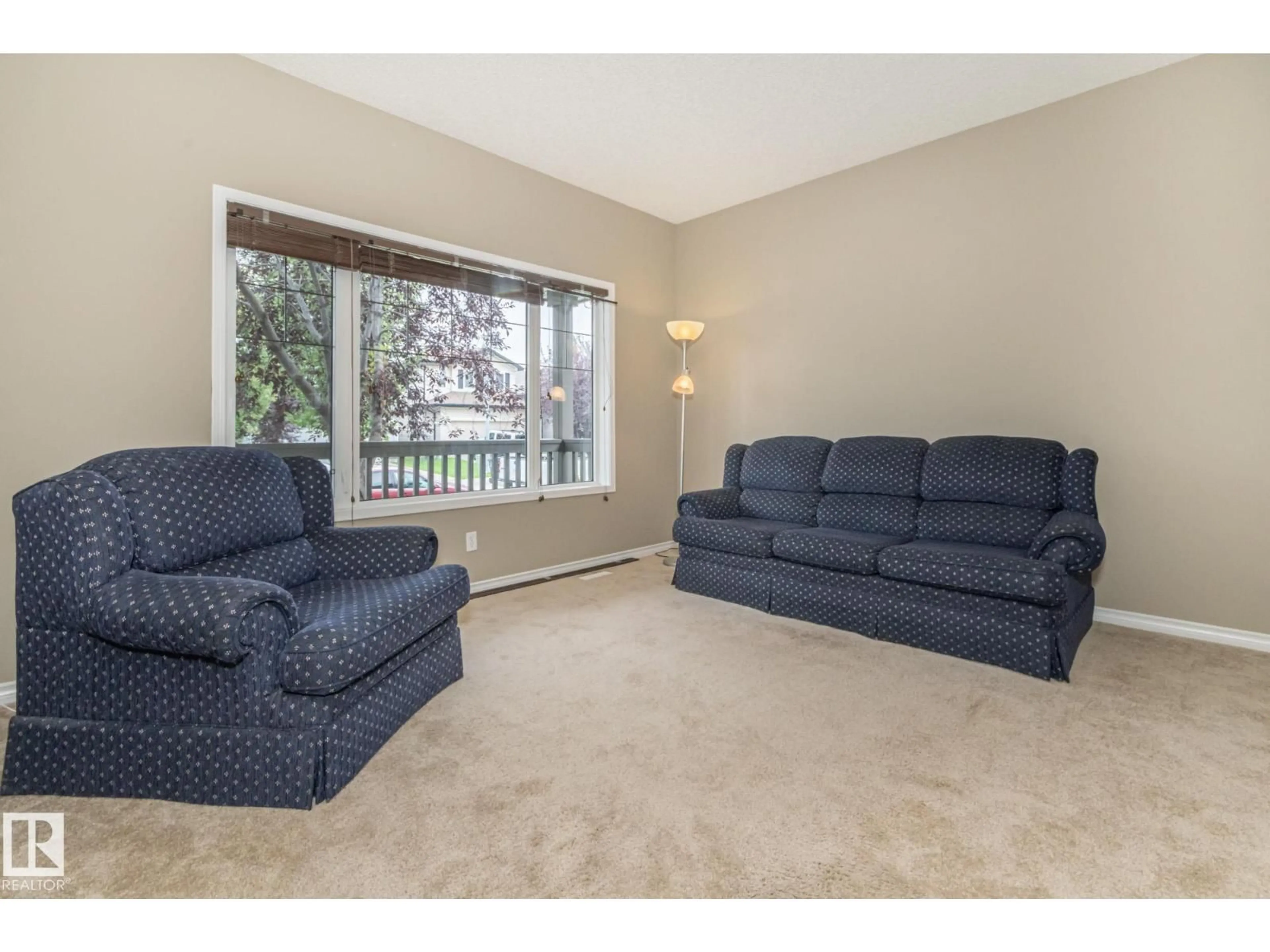 Living room with furniture, carpet floor for 4020 158 AV, Edmonton Alberta T5Y0A3