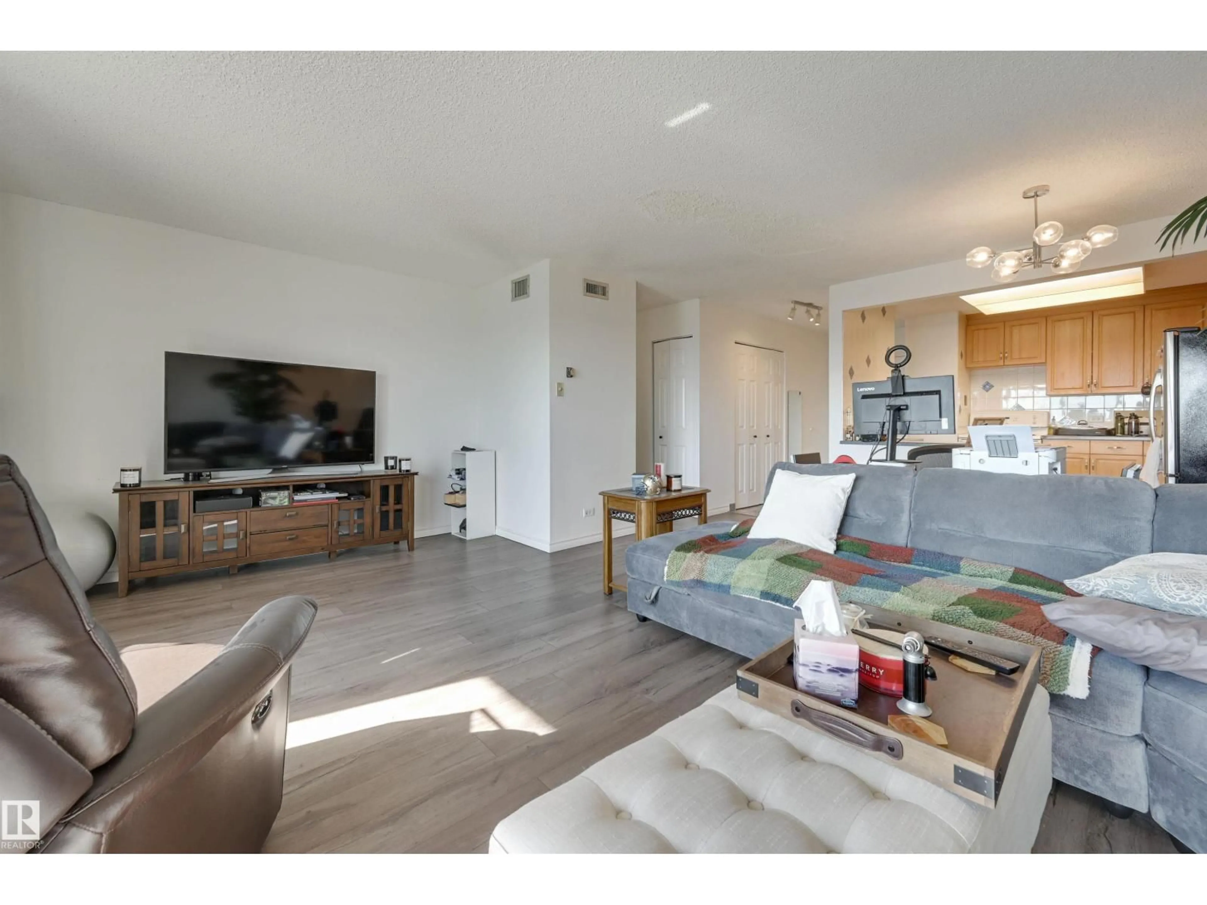 Living room with furniture, wood/laminate floor for 11027 - 1204 87 AV, Edmonton Alberta T6G2P9