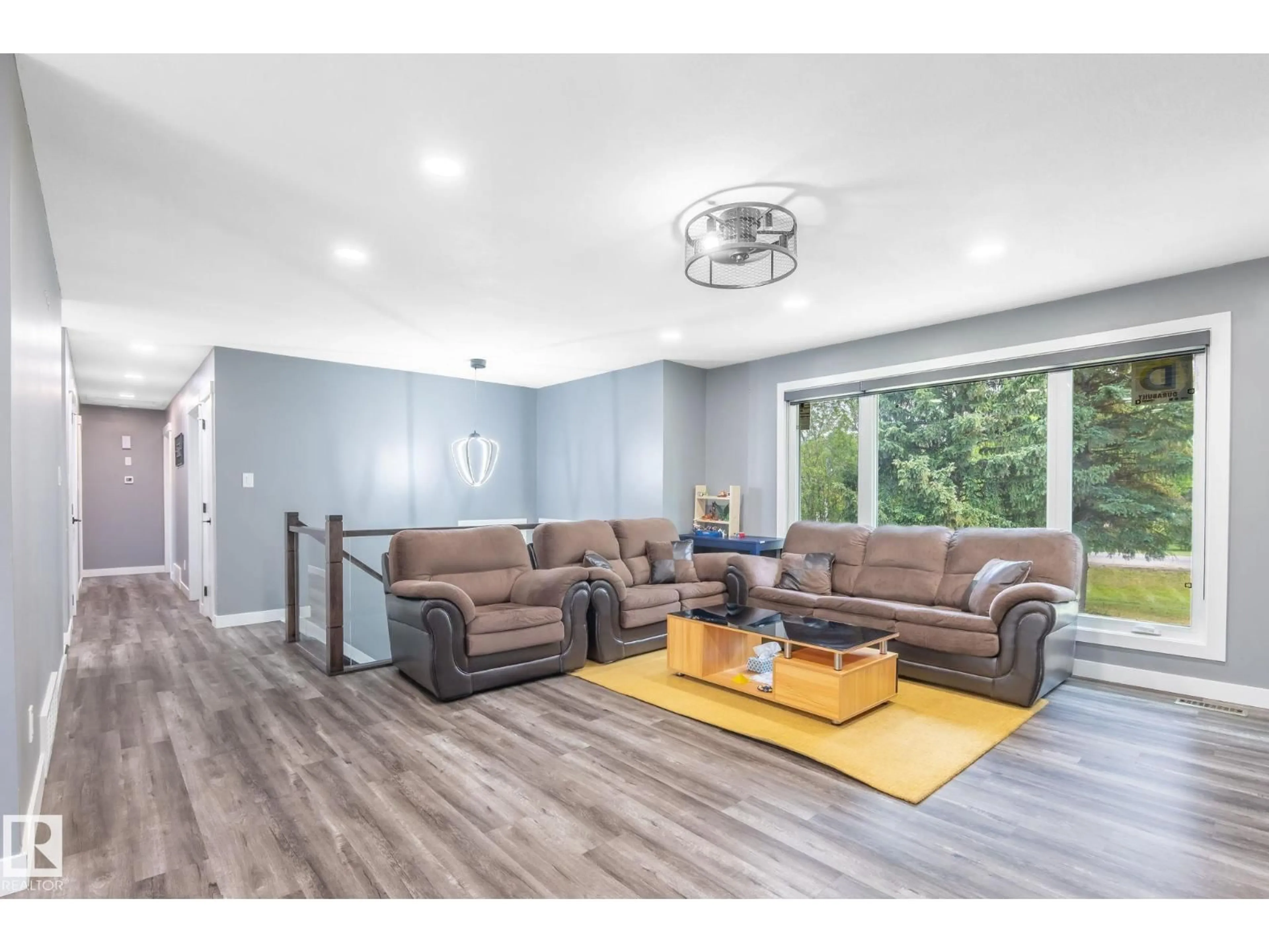 Living room with furniture, wood/laminate floor for 253 TWP ROAD 522 TWP ROAD, Sherwood Park Alberta T8B1G8