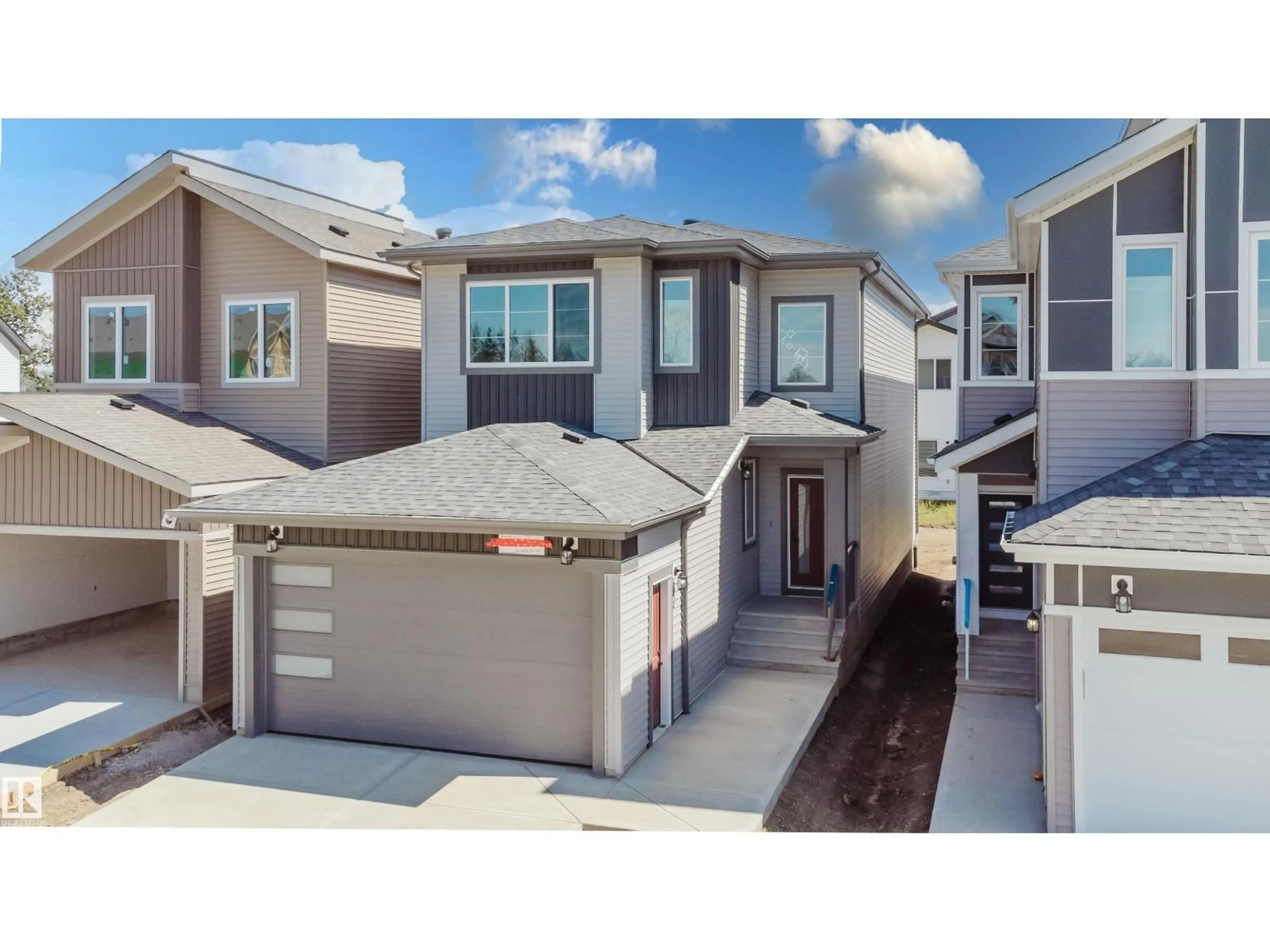 Home with vinyl exterior material, street for NW - 2555 211 ST, Edmonton Alberta T6M3H2