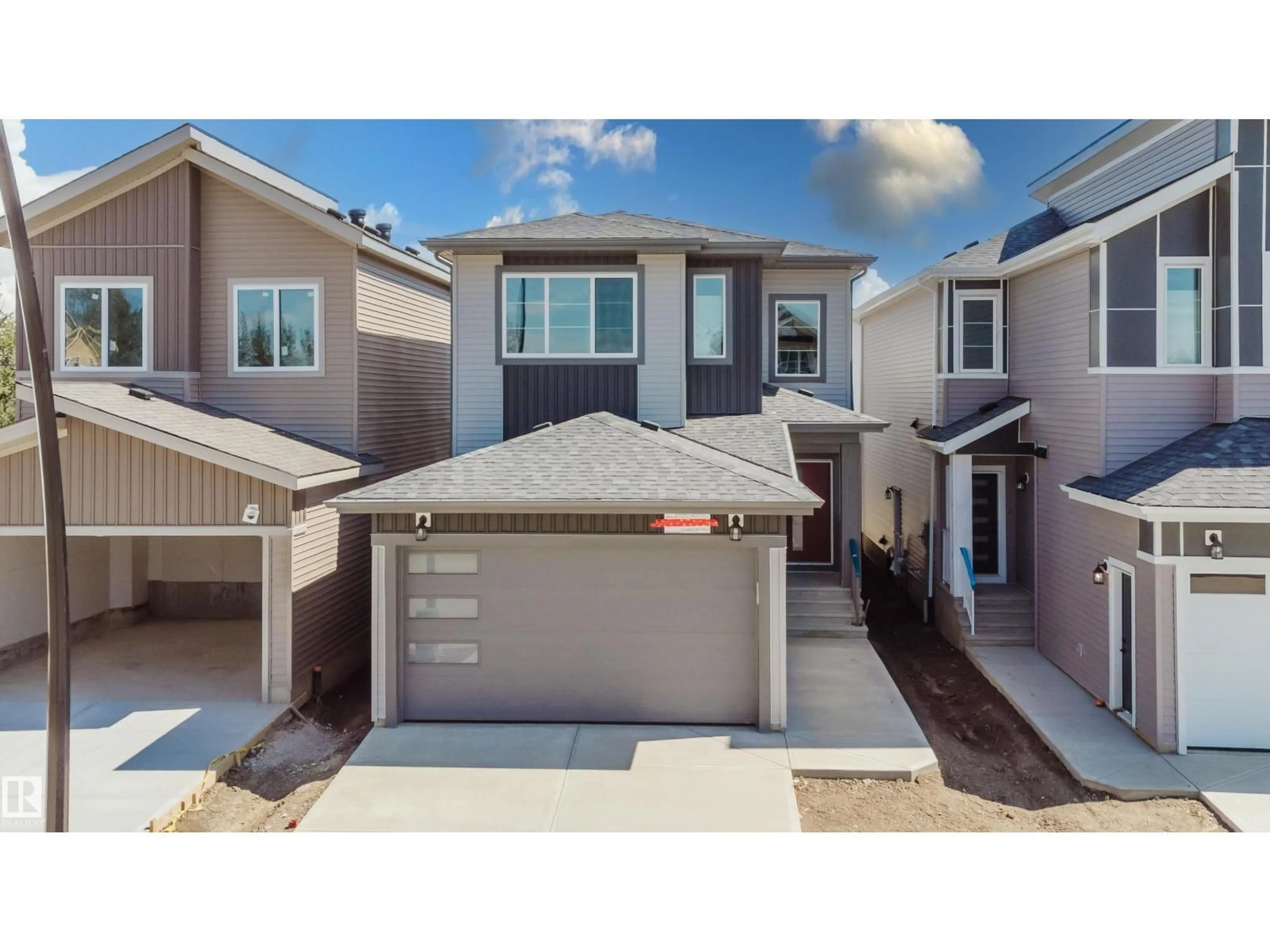 Home with vinyl exterior material, street for NW - 2555 211 ST, Edmonton Alberta T6M3H2