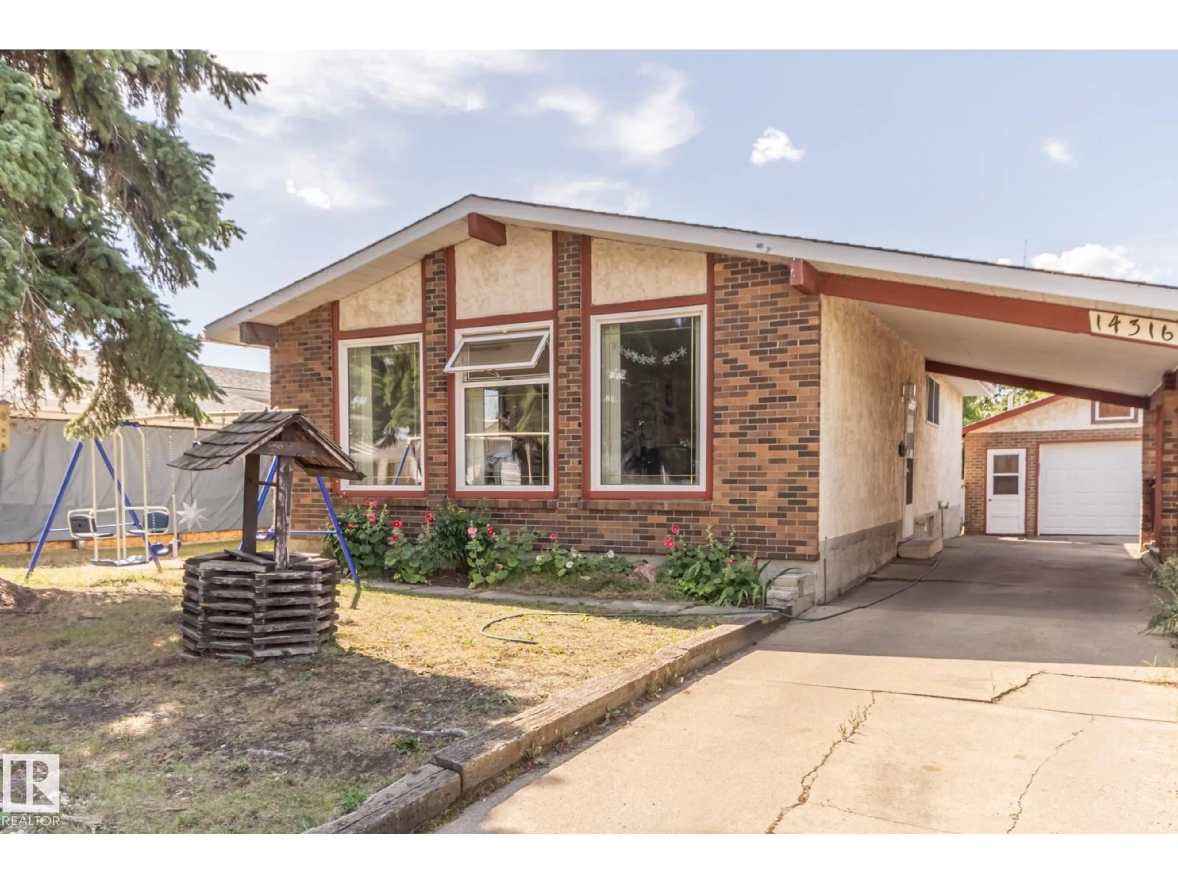 Home with brick exterior material, street for NW - 14316 116 ST, Edmonton Alberta T5X1N4