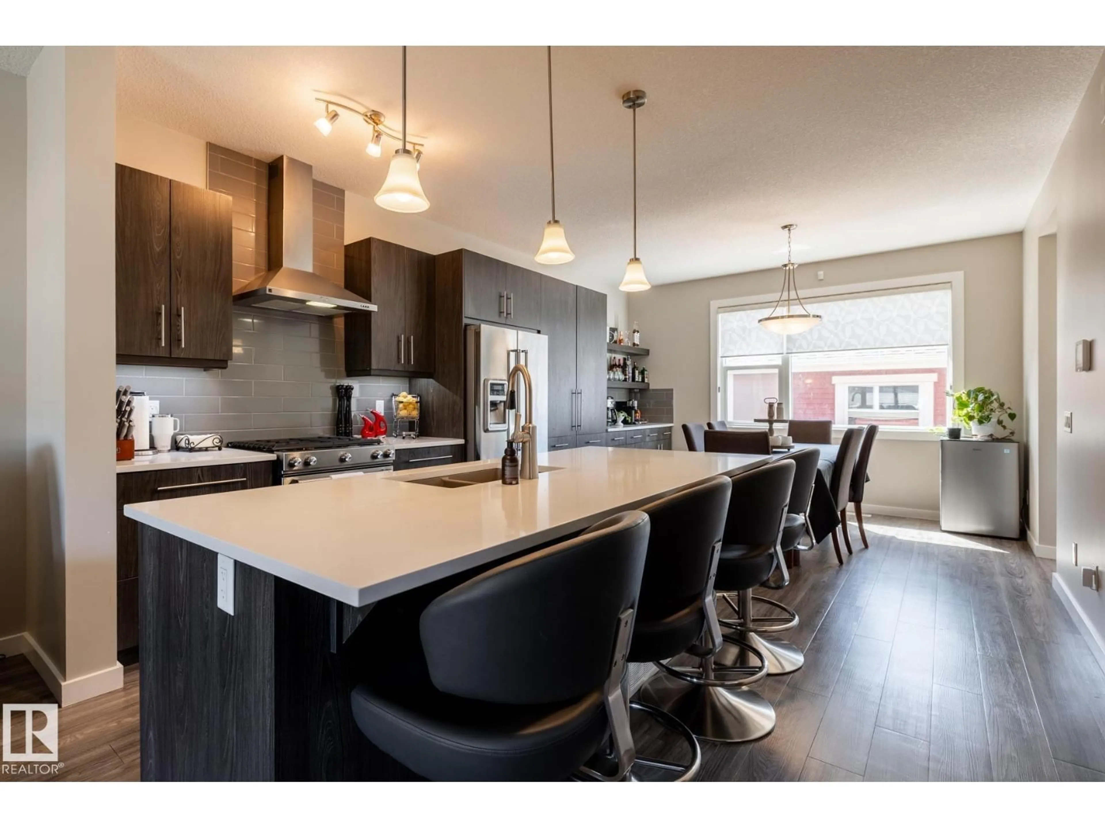 Open concept kitchen, wood/laminate floor for 7403 COLONEL MEWBURN RD, Edmonton Alberta T5E6V7