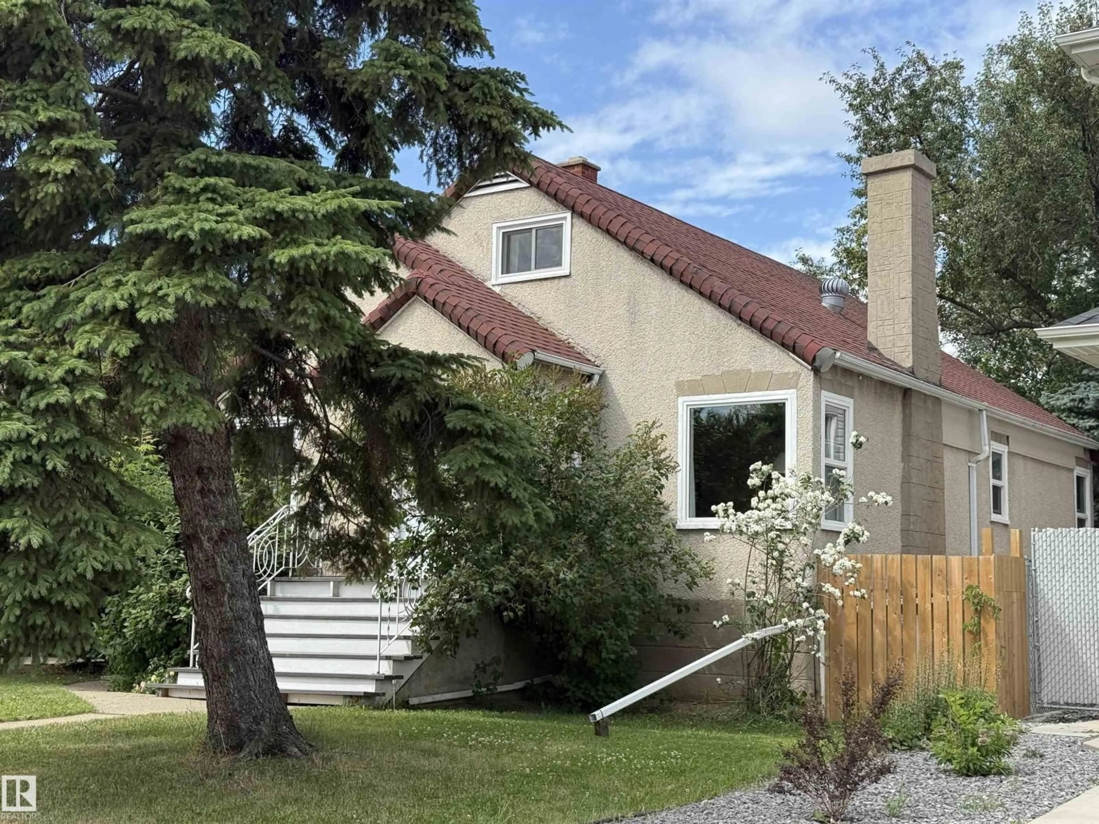 Home with vinyl exterior material, street for 11522 101 ST, Edmonton Alberta T5G0E9