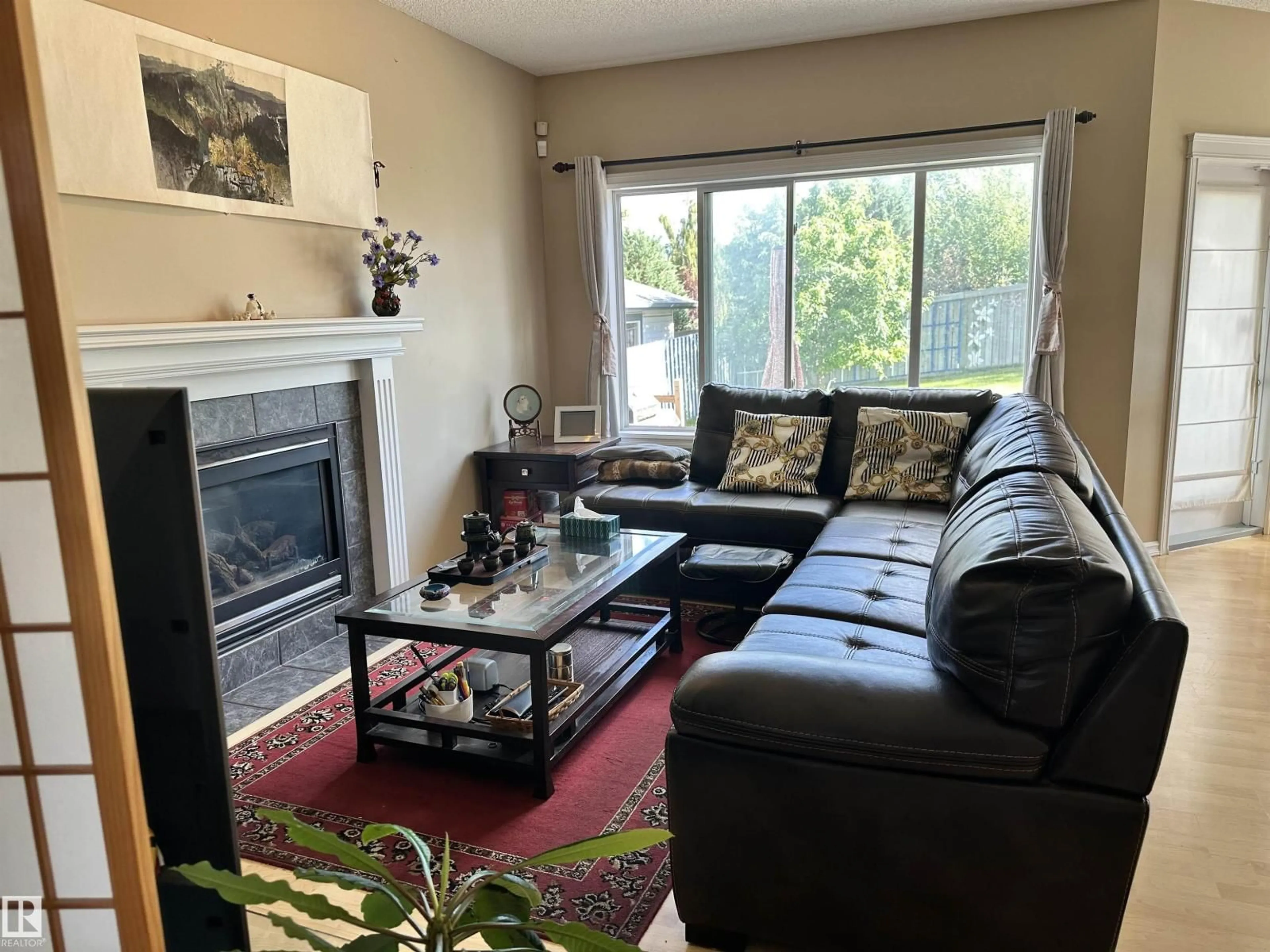 Living room with furniture, unknown for NW - 4619 151 AV, Edmonton Alberta T5Y3A1