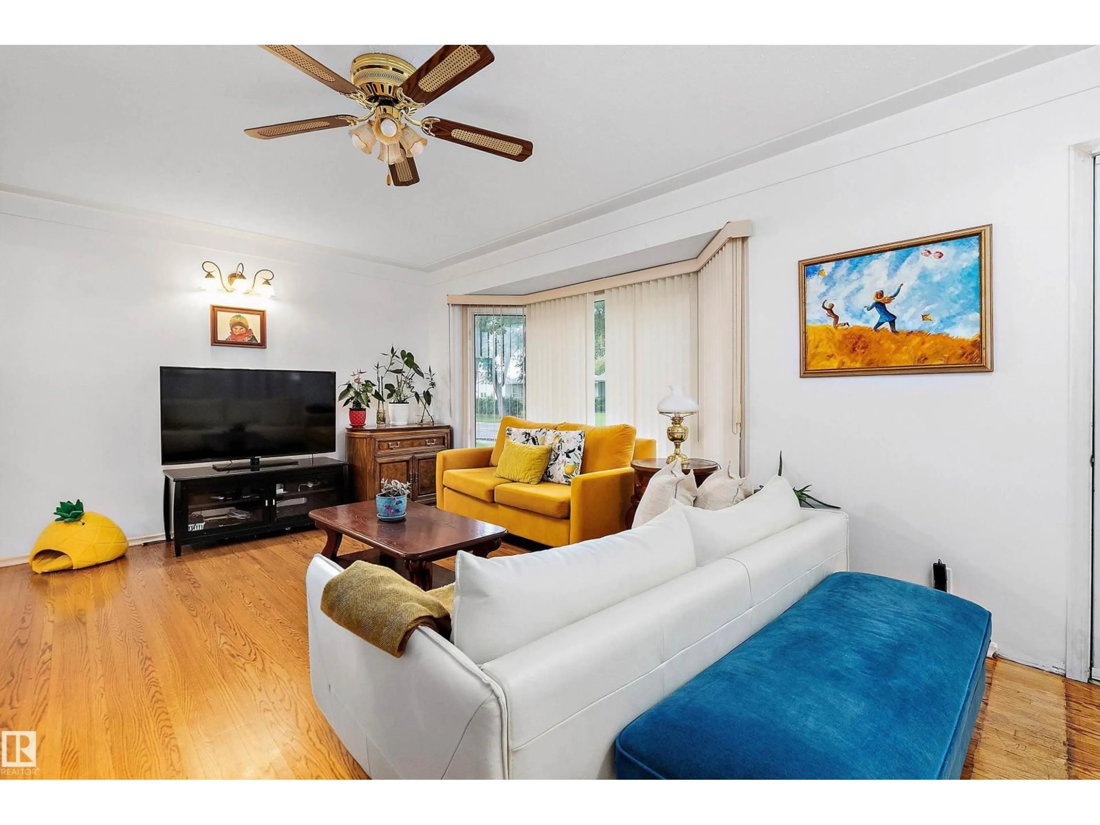 Living room with furniture, wood/laminate floor for 5207 47 AV, Leduc Alberta T9E5E1