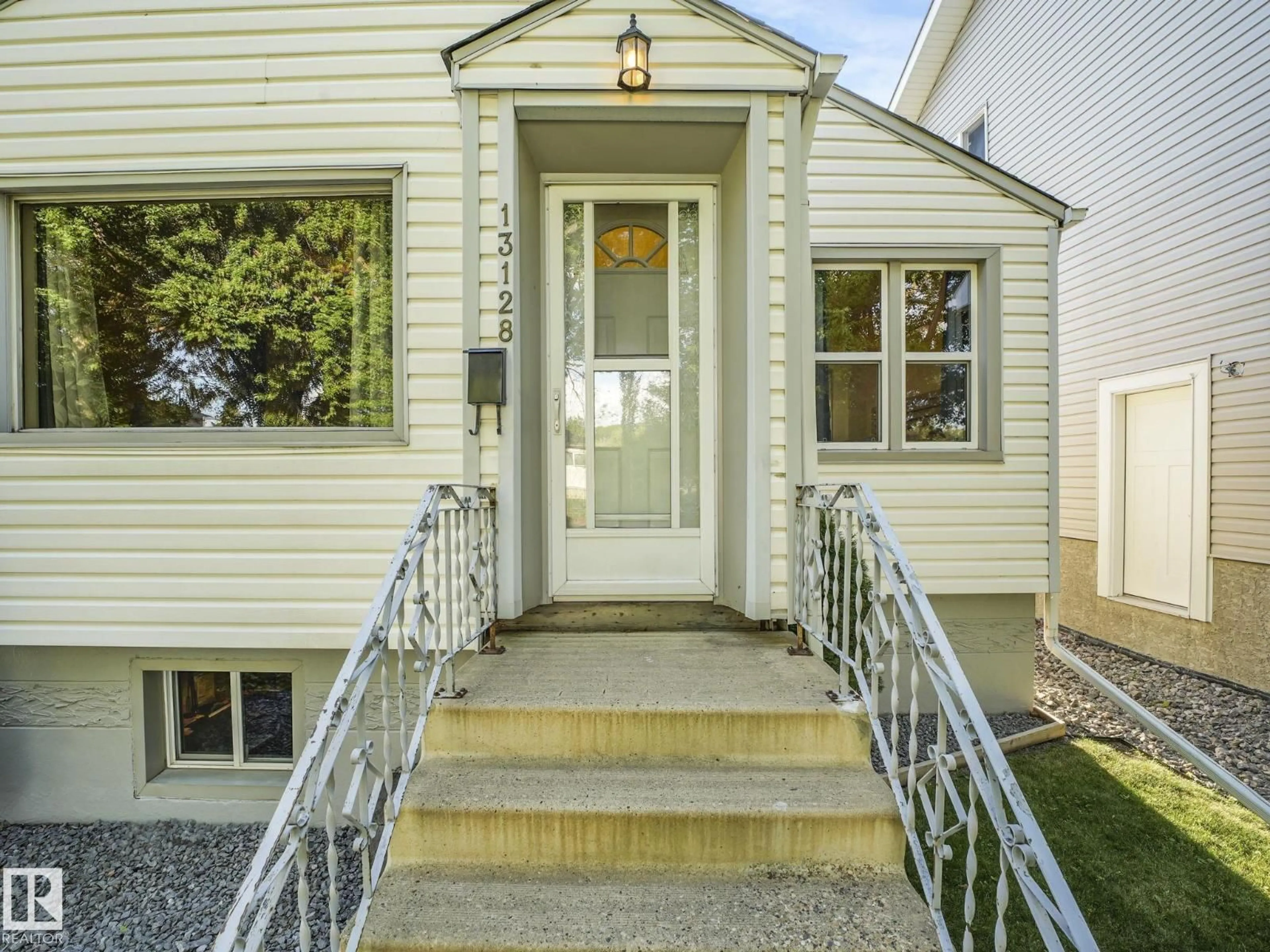 Home with vinyl exterior material, street for 13128 64 ST, Edmonton Alberta T6J6B7