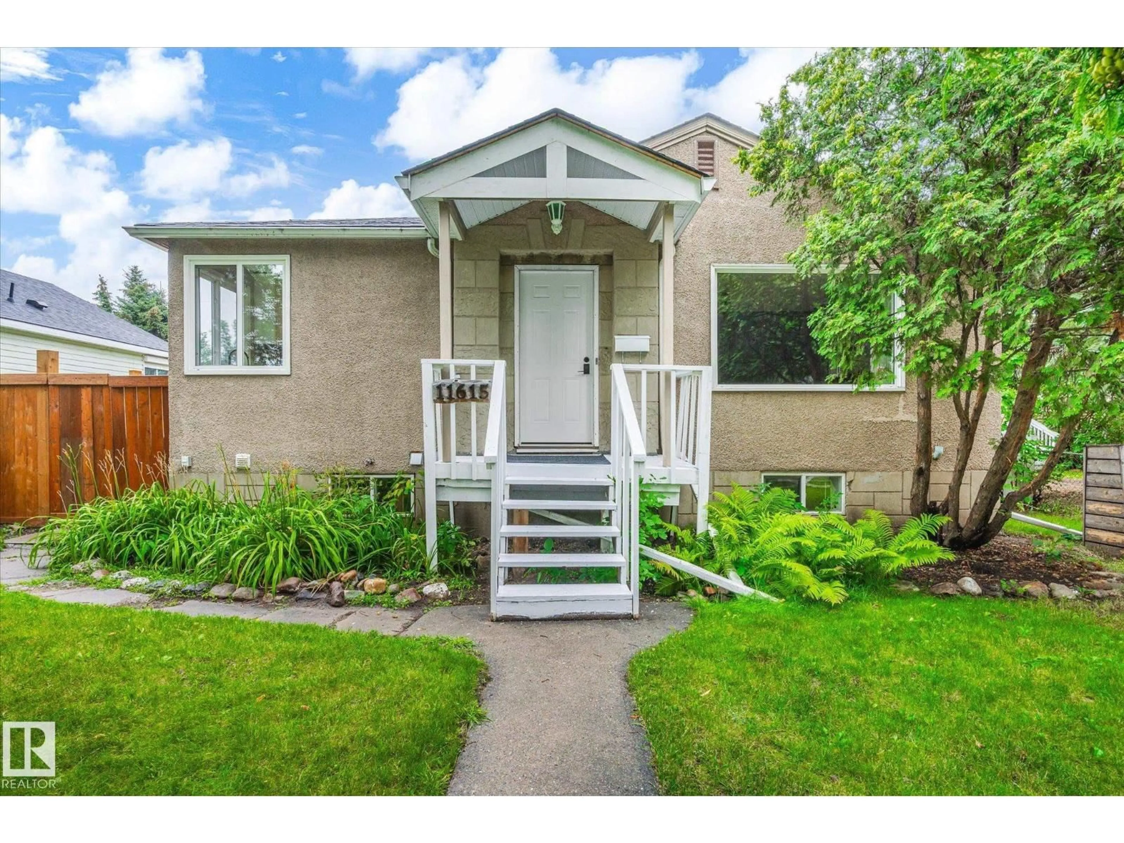 Home with vinyl exterior material, street for 11615 71 ST, Edmonton Alberta T5B1W3