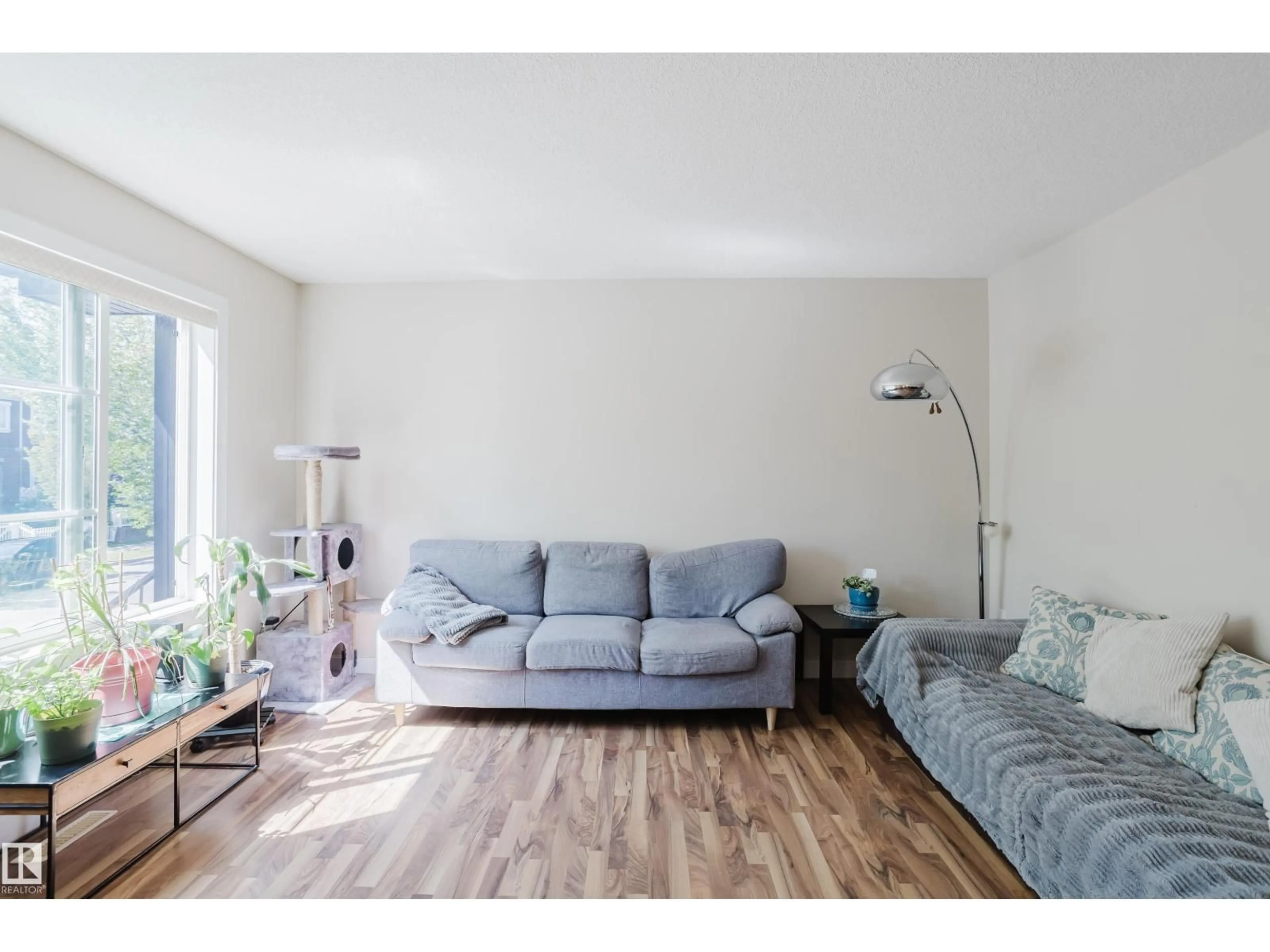 Living room with furniture, wood/laminate floor for #11 - 5260 TERWILLEGAR BV, Edmonton Alberta T6R0S1