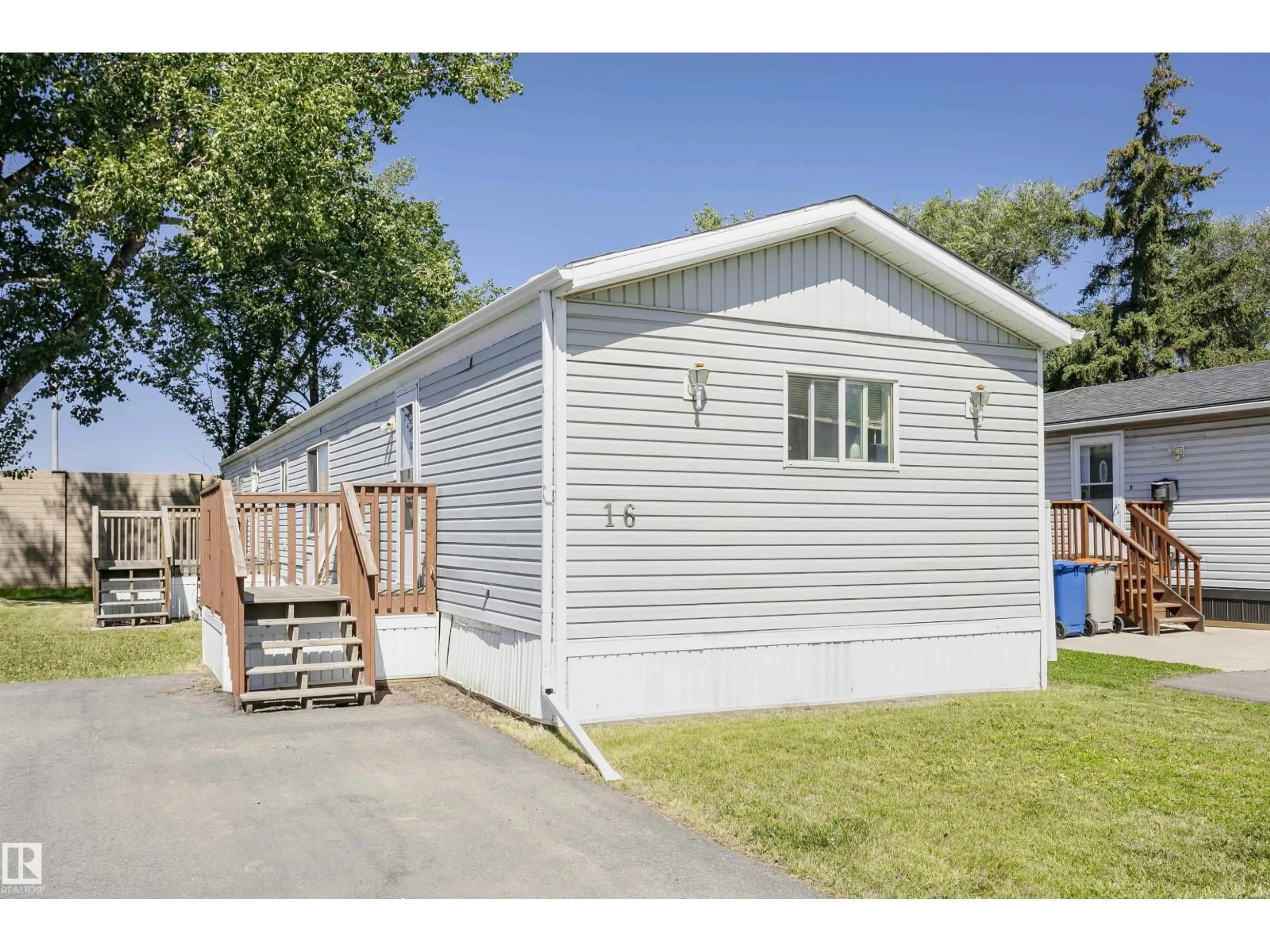Home with vinyl exterior material, street for 16 WILLOW PARK ESTATES, Leduc Alberta T9E5P8