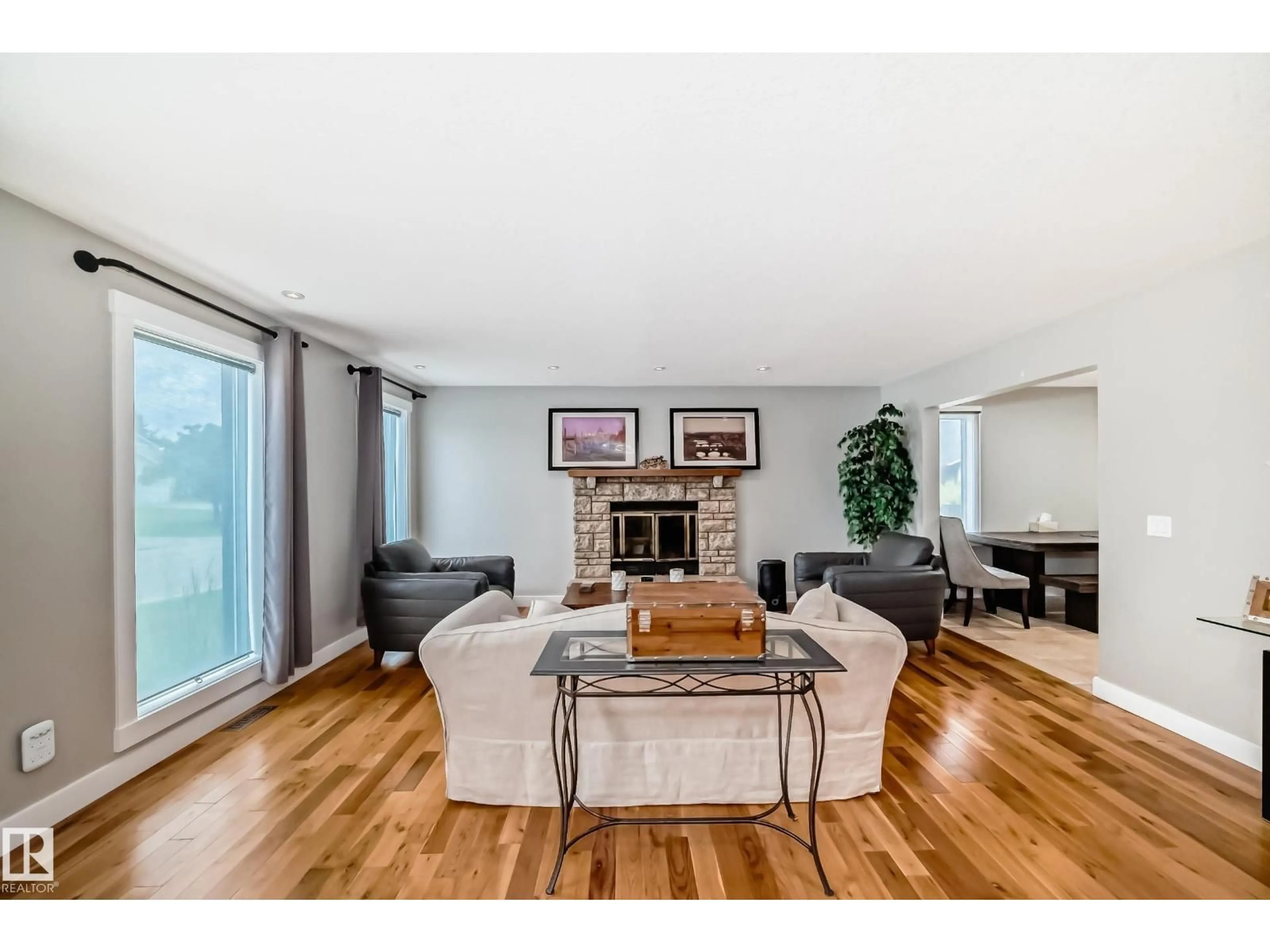Living room with furniture, wood/laminate floor for 12403 29A AV, Edmonton Alberta T6J6C7