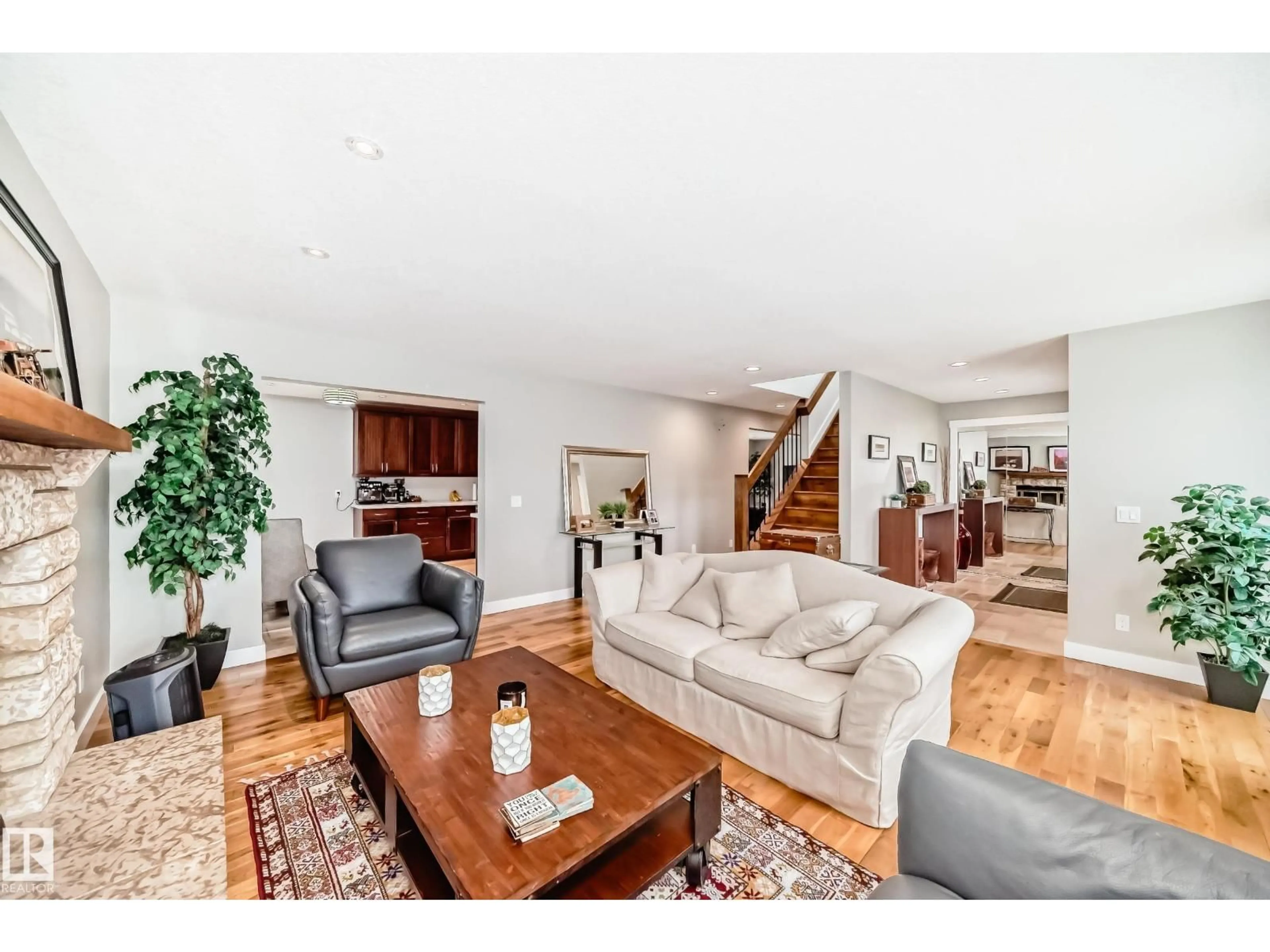 Living room with furniture, wood/laminate floor for 12403 29A AV, Edmonton Alberta T6J6C7