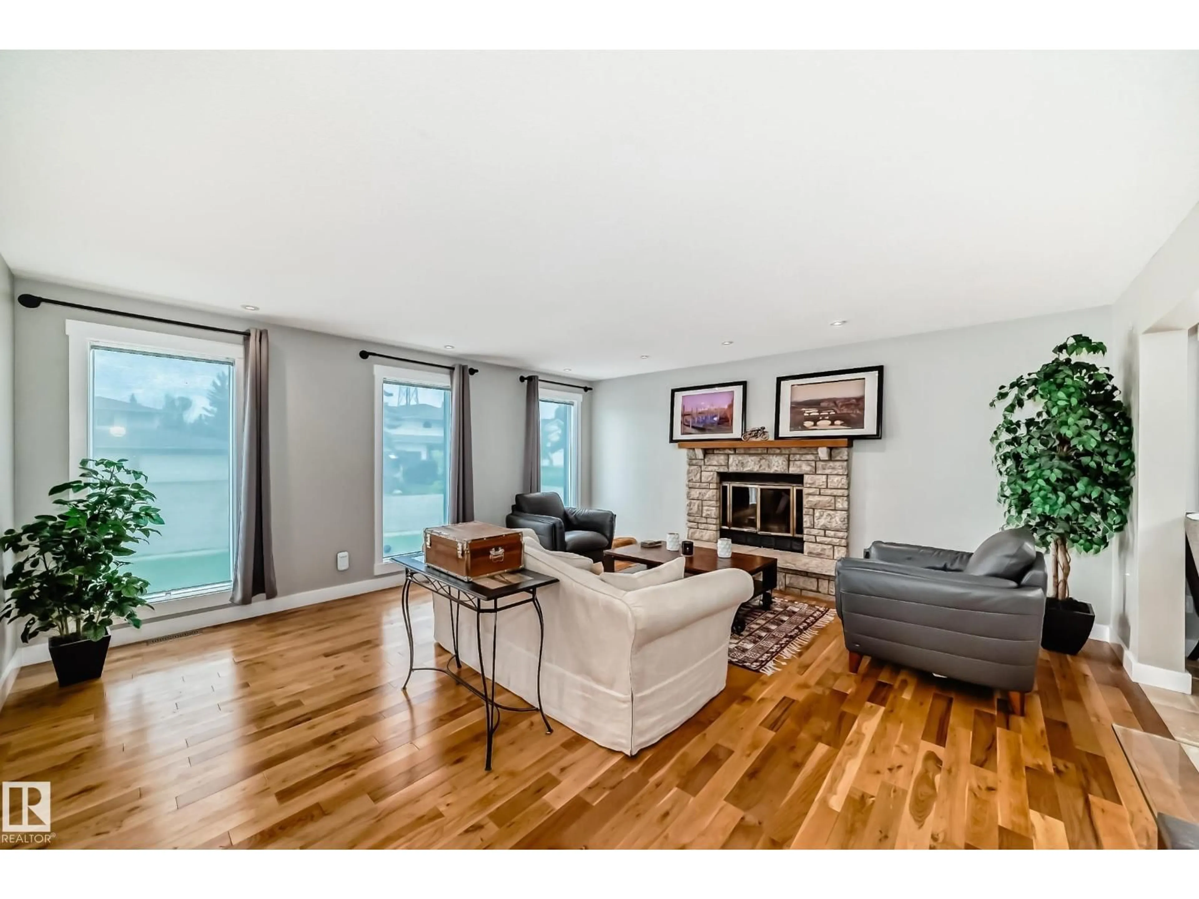 Living room with furniture, wood/laminate floor for 12403 29A AV, Edmonton Alberta T6J6C7