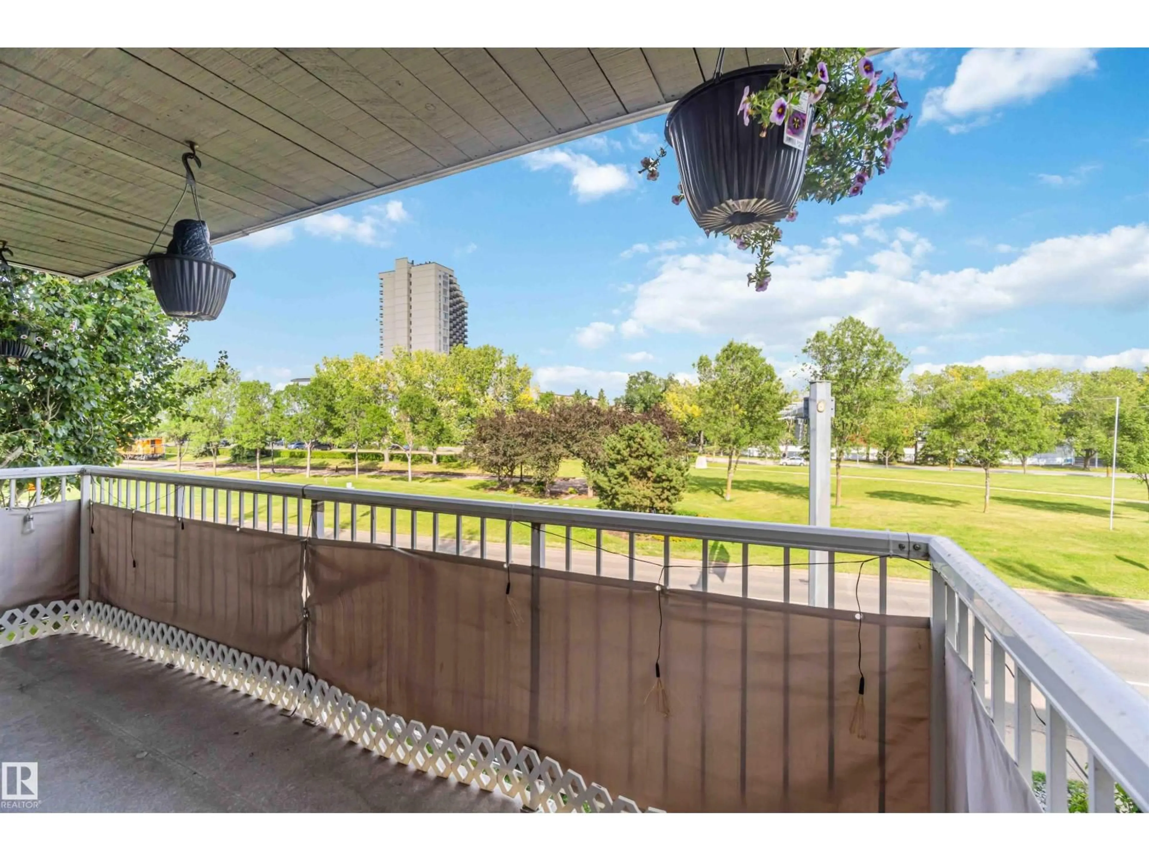 Patio, city buildings view from balcony for 310 - 8604 GATEWAY BV, Edmonton Alberta T6E4B6