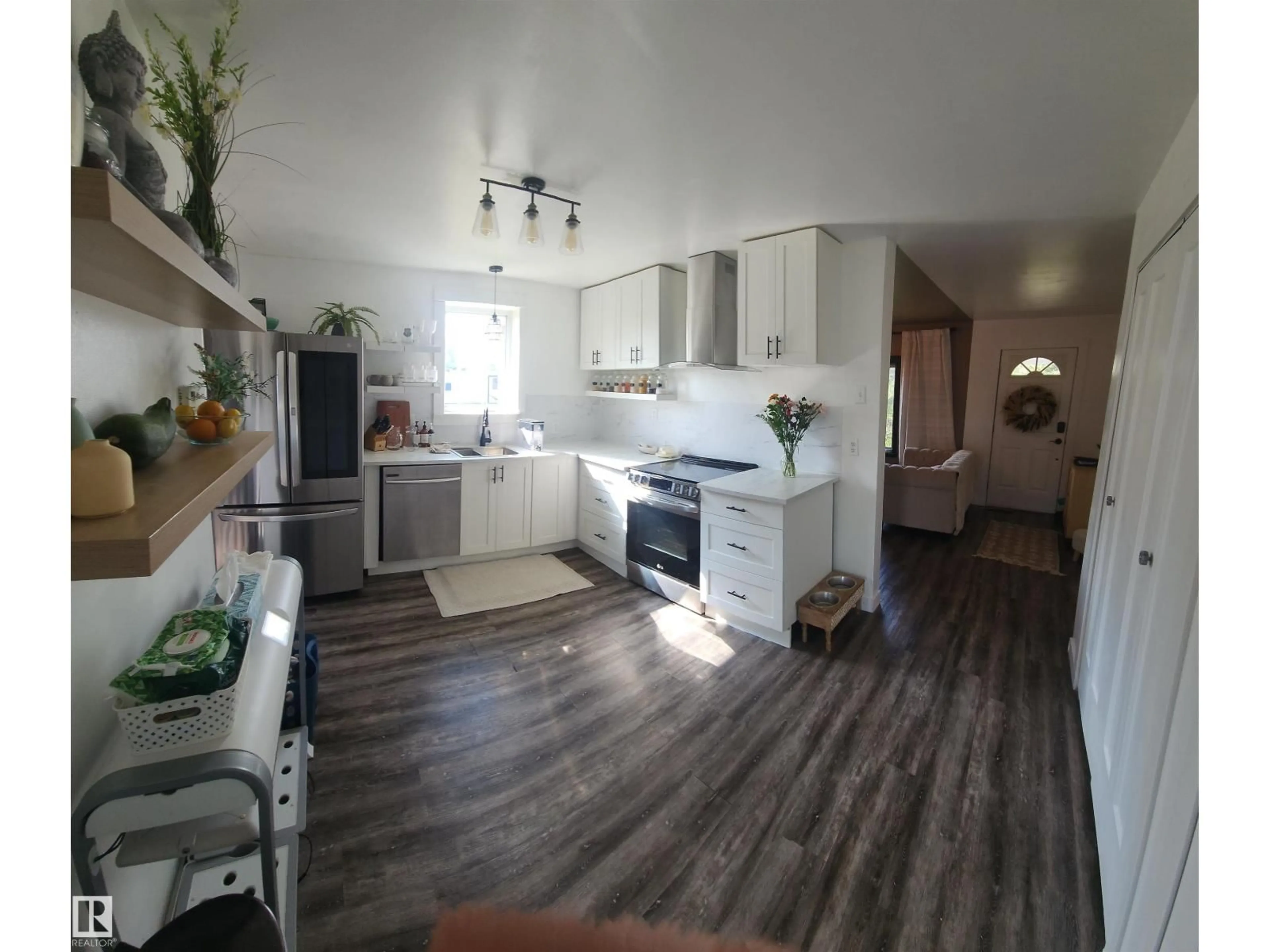 Open concept kitchen, wood/laminate floor for 5009 50 AV, Pickardville Alberta T0G1W0