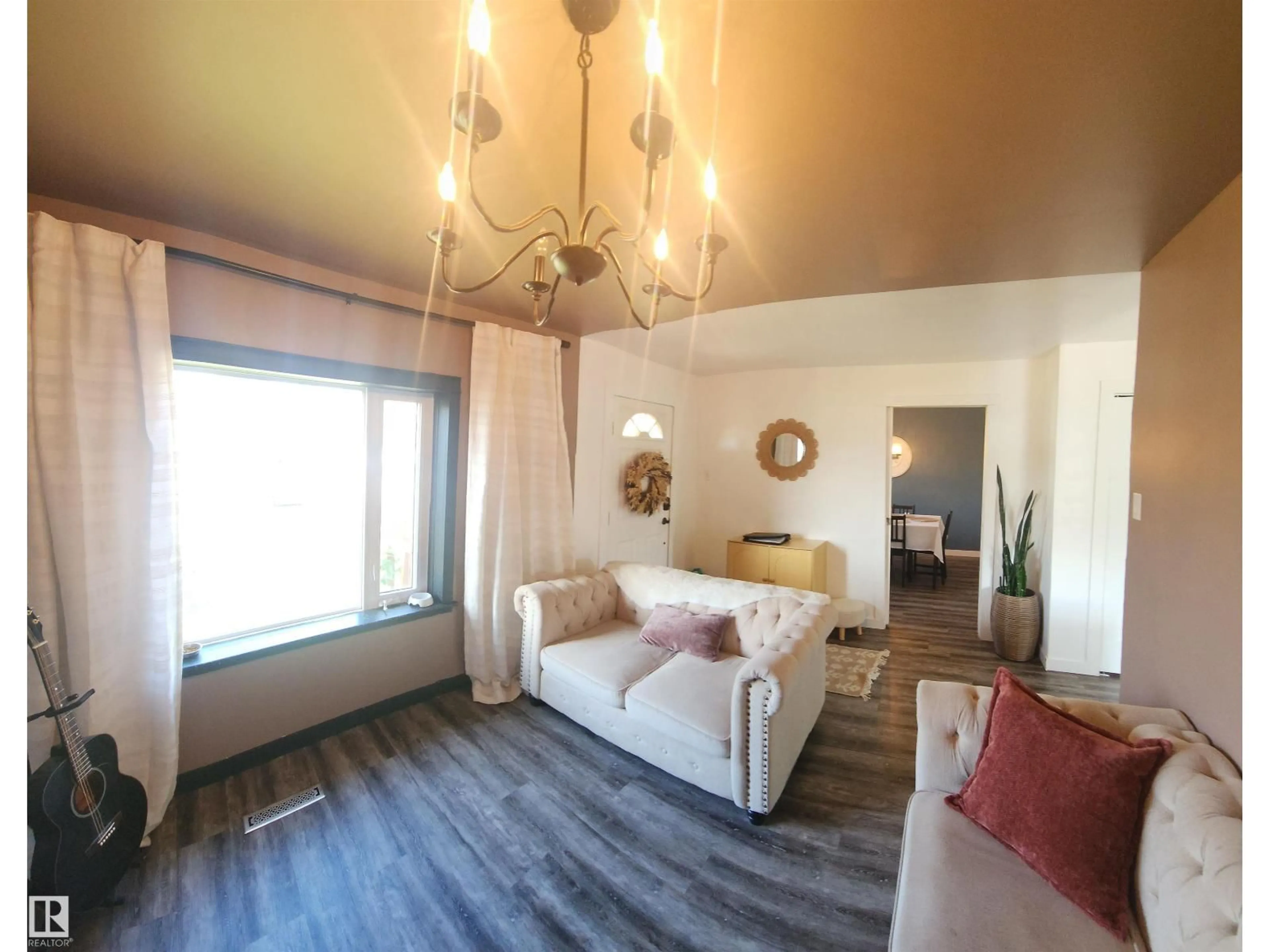 Living room with furniture, wood/laminate floor for 5009 50 AV, Pickardville Alberta T0G1W0