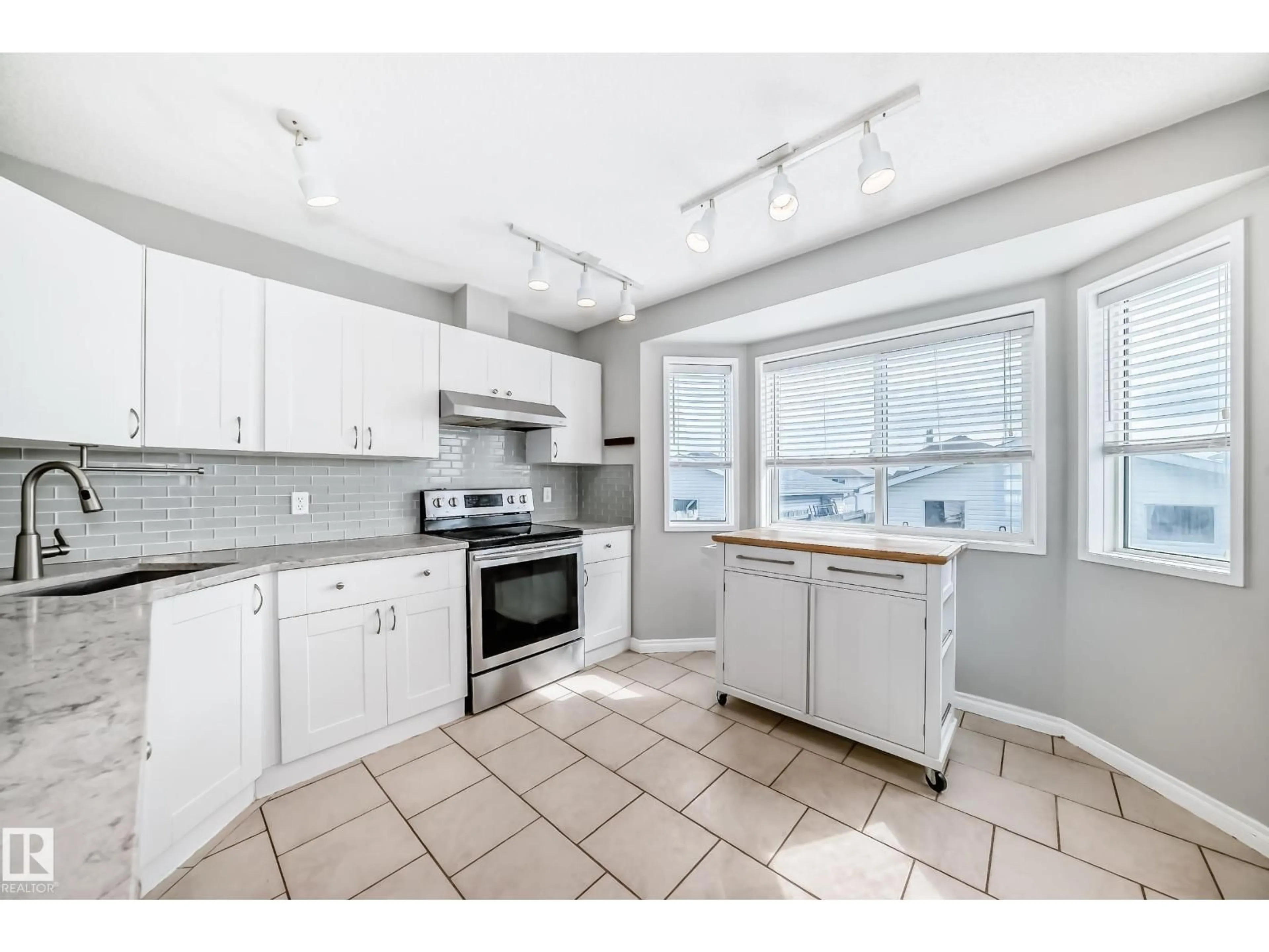 Open concept kitchen, ceramic/tile floor for 16217 57 ST, Edmonton Alberta T5Y2V3