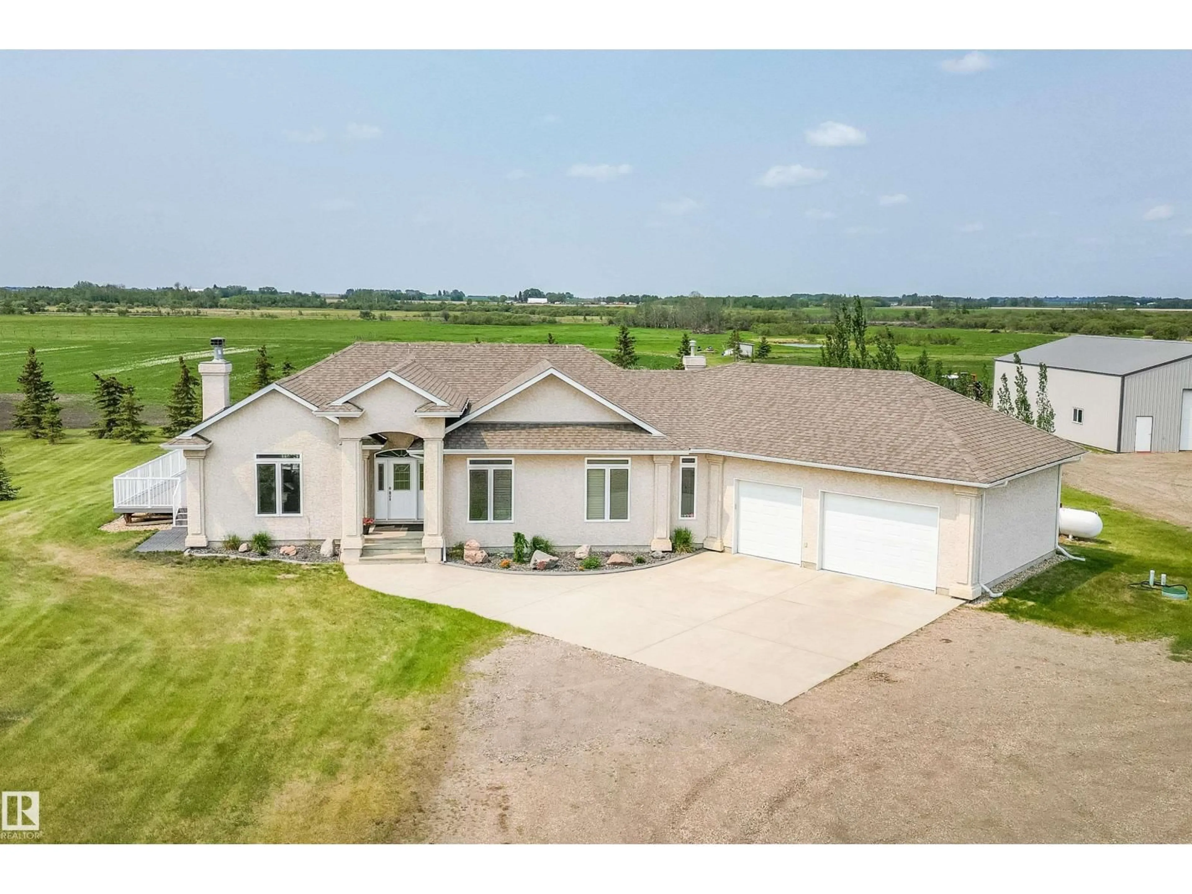 A pic from outside/outdoor area/front of a property/back of a property/a pic from drone, water/lake/river/ocean view for 55116 RGE RD 234, Rural Sturgeon County Alberta T8T2A7