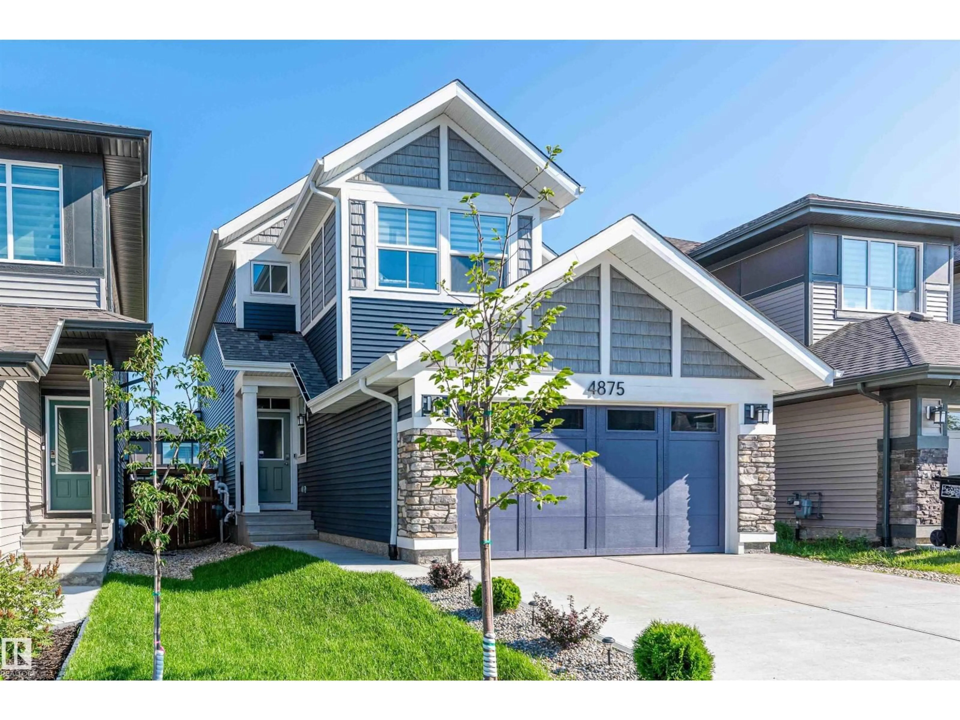Home with vinyl exterior material, street for 4875 KINNEY RD, Edmonton Alberta T6W5G3