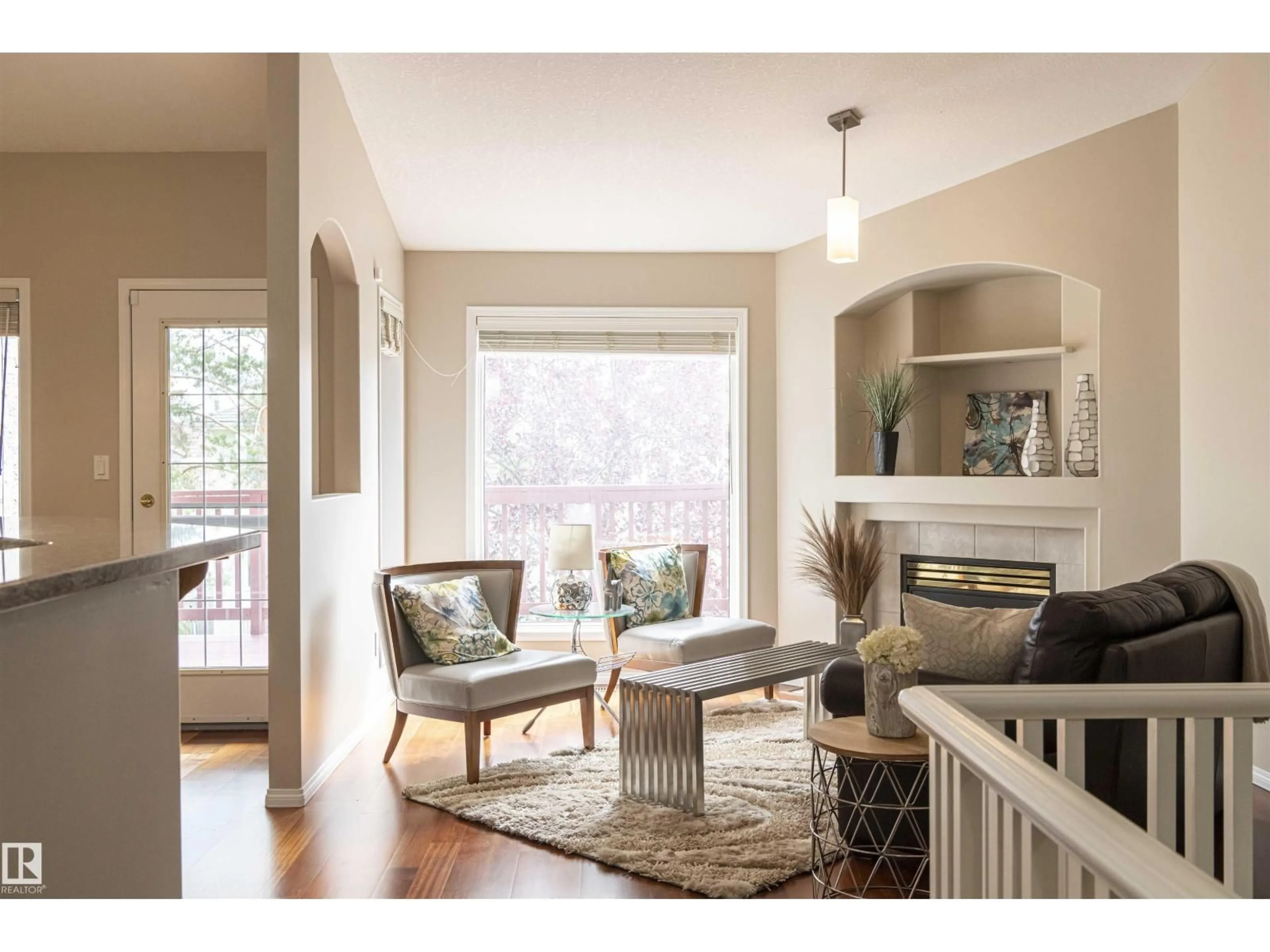 Living room with furniture, wood/laminate floor for #6 - 1203 CARTER CREST RD, Edmonton Alberta T6R2R1