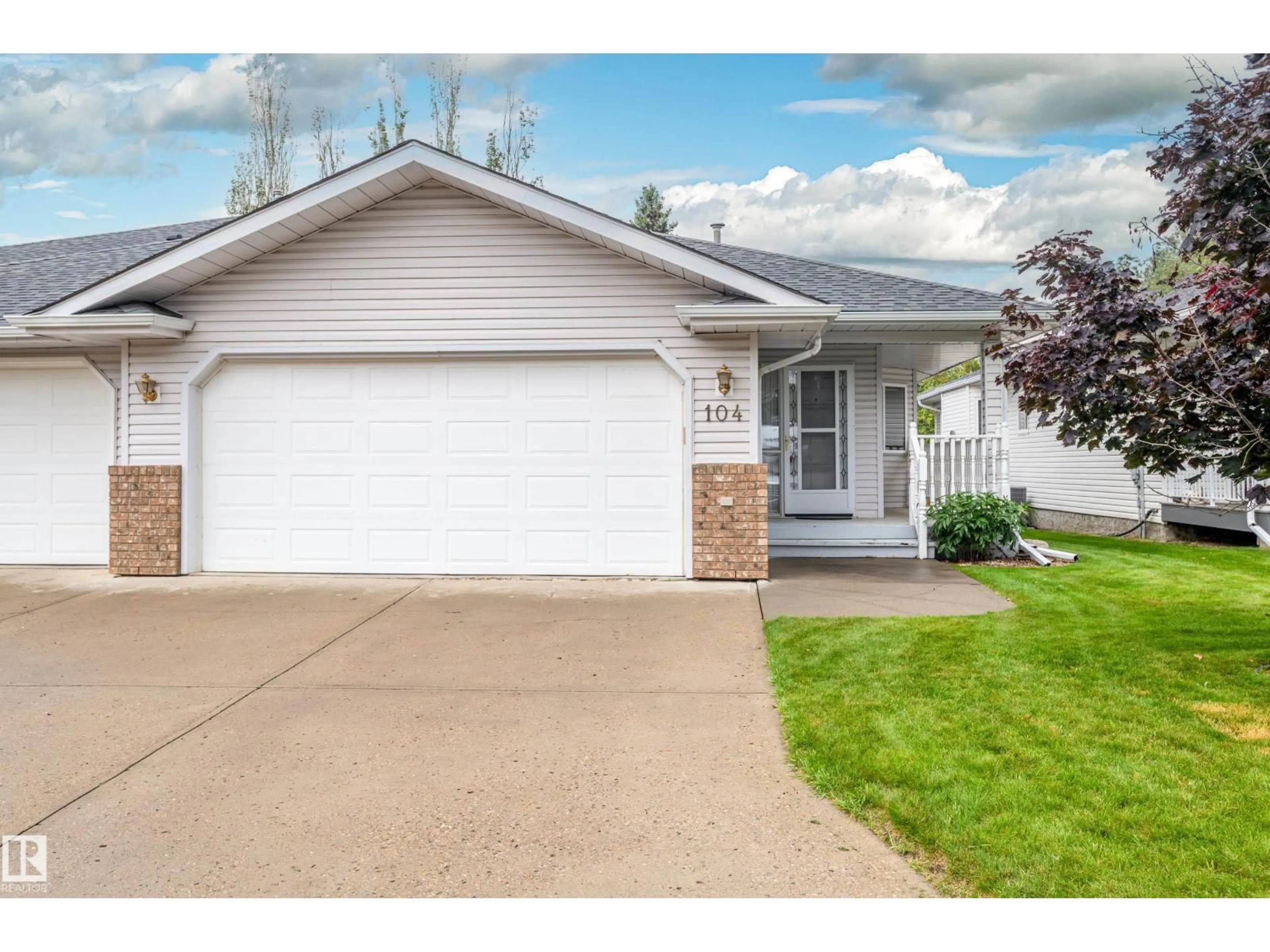 Home with vinyl exterior material, street for 104 LAKESIDE PL, Leduc Alberta T9E6P3