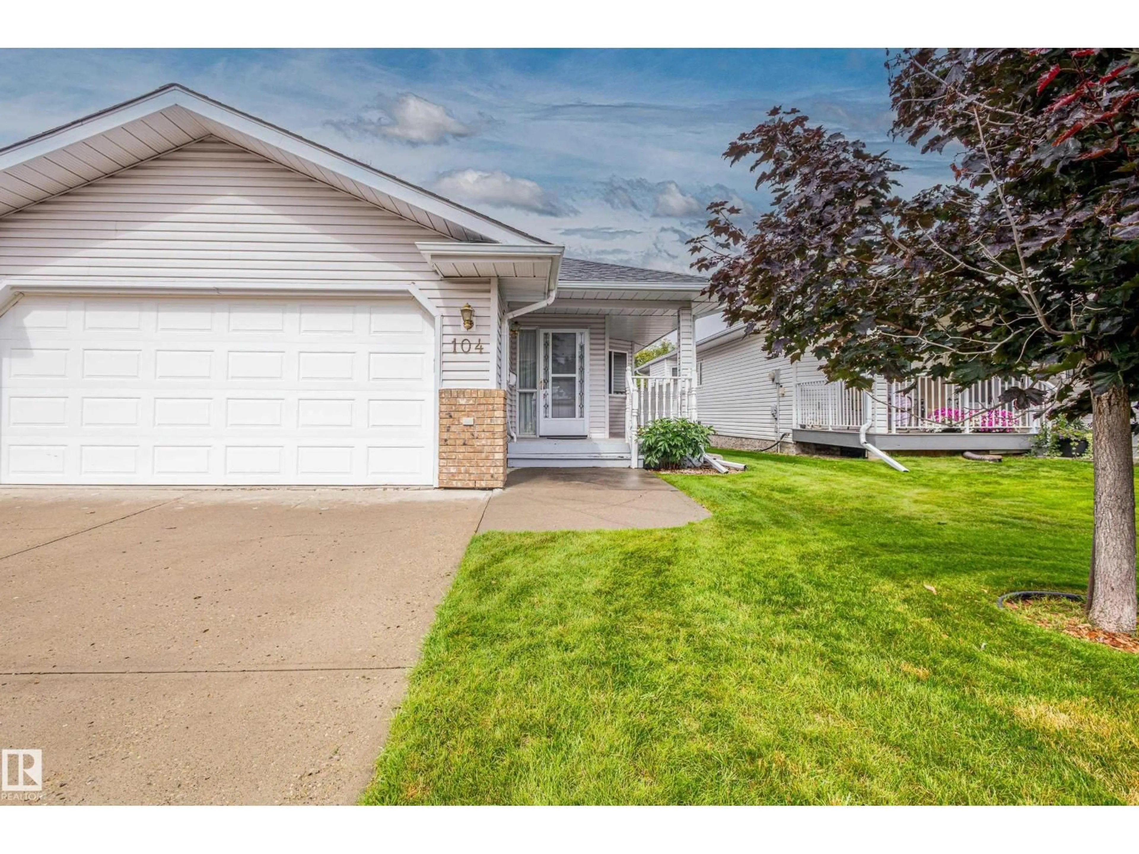 Home with vinyl exterior material, street for 104 LAKESIDE PL, Leduc Alberta T9E6P3