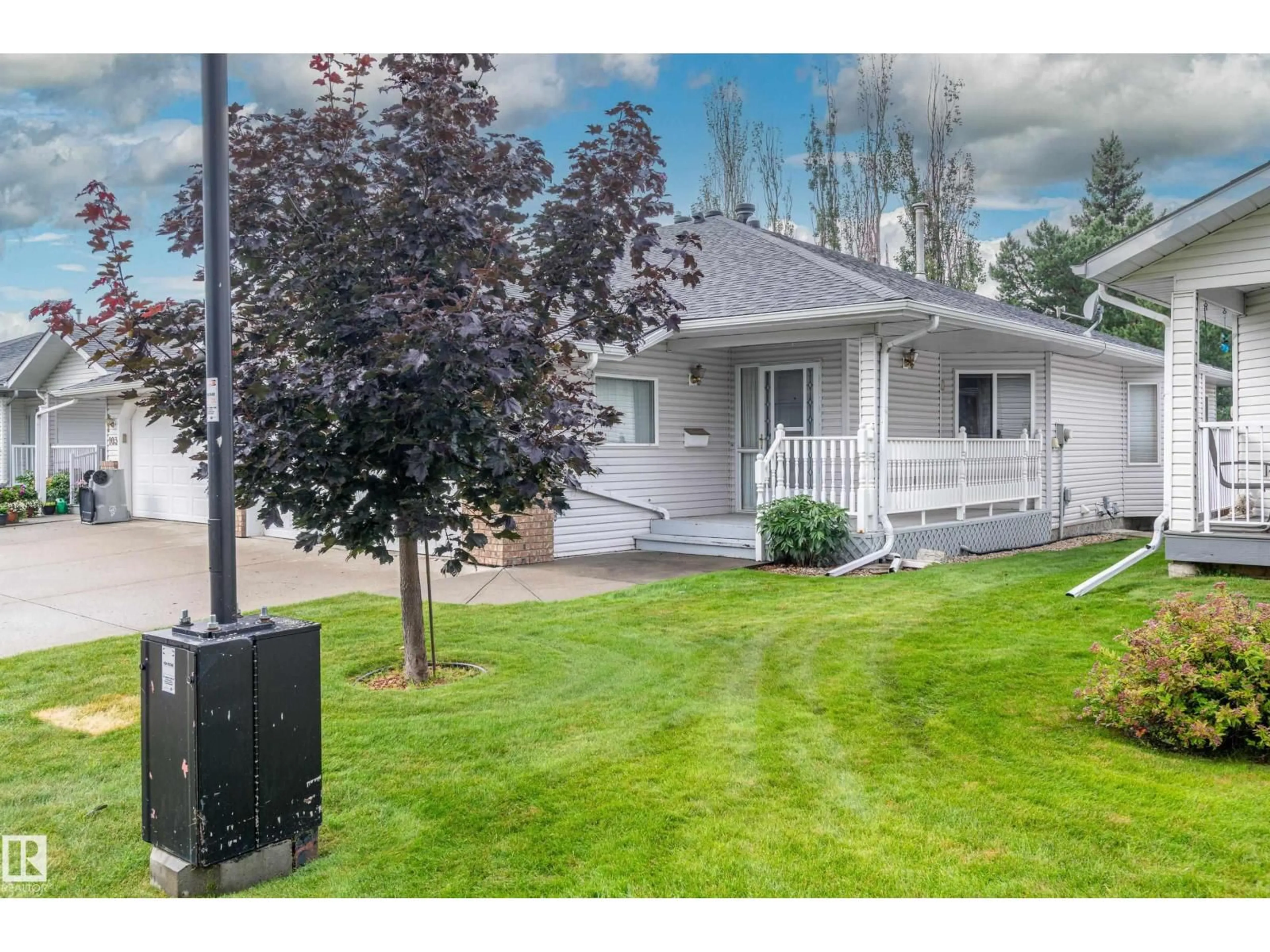 Home with vinyl exterior material, street for 104 LAKESIDE PL, Leduc Alberta T9E6P3