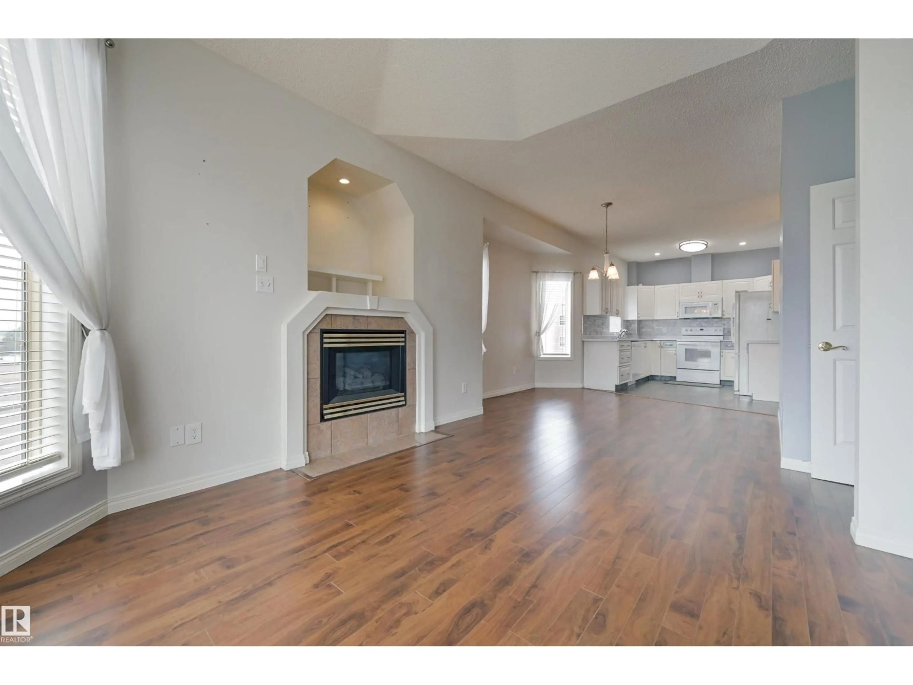 Open concept kitchen, wood/laminate floor for #304 - 11308 130 AV, Edmonton Alberta T5E6L2