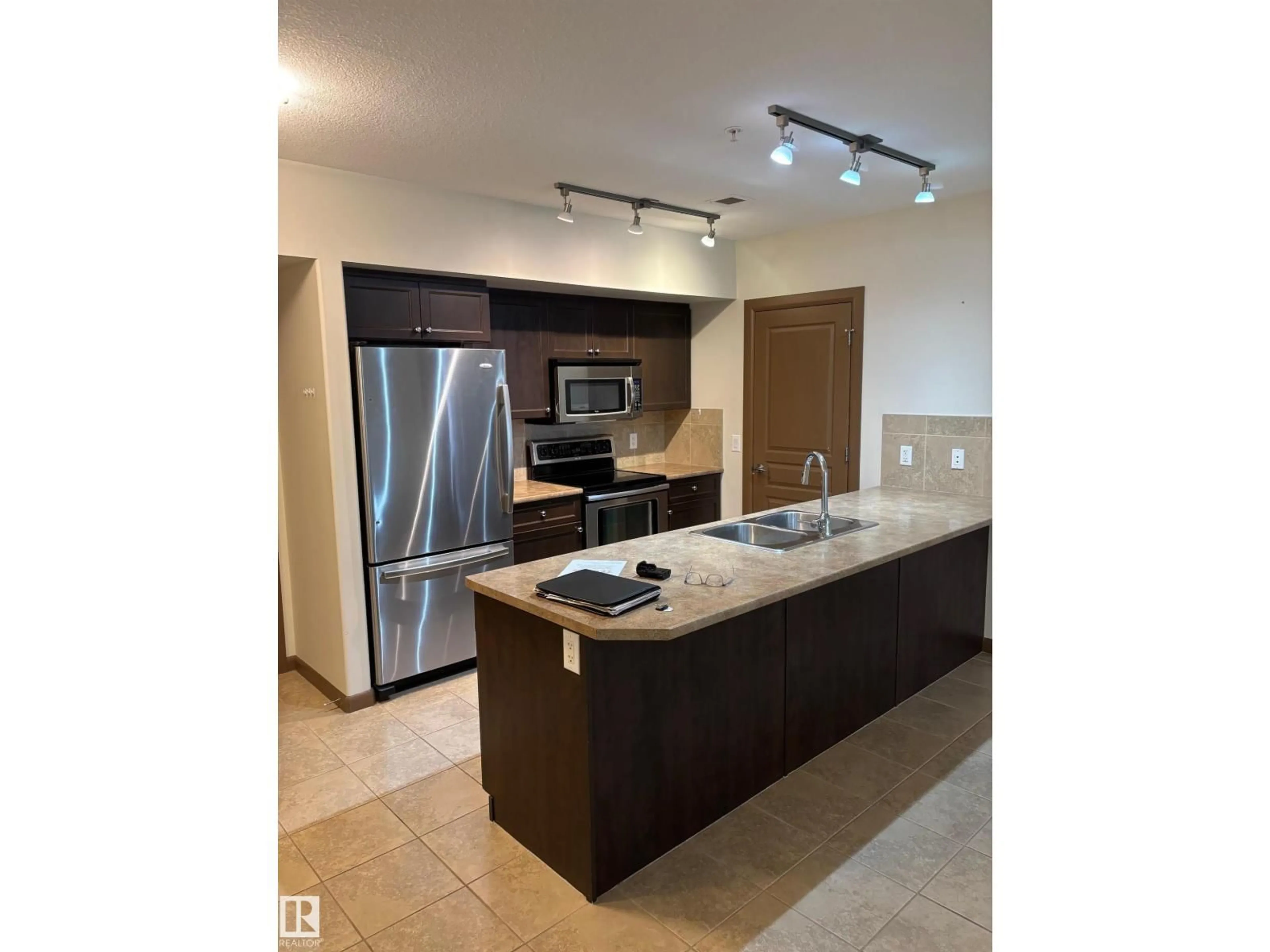 Open concept kitchen, ceramic/tile floor for #213 - 500 PALISADES WY, Sherwood Park Alberta T8H0H7