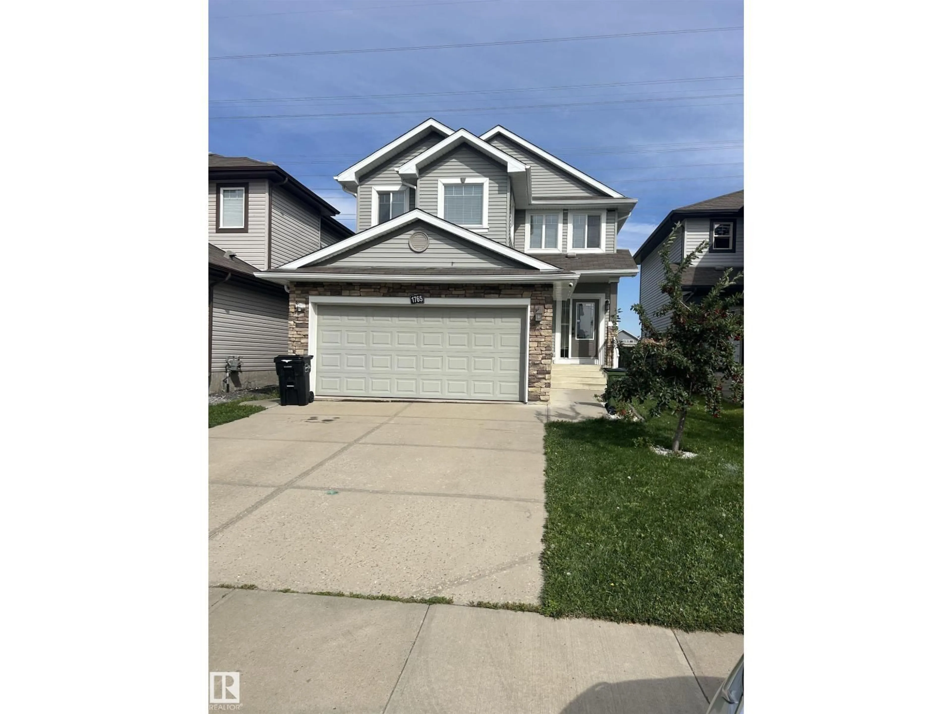 Home with vinyl exterior material, street for 1765 28 ST, Edmonton Alberta T6T0R6