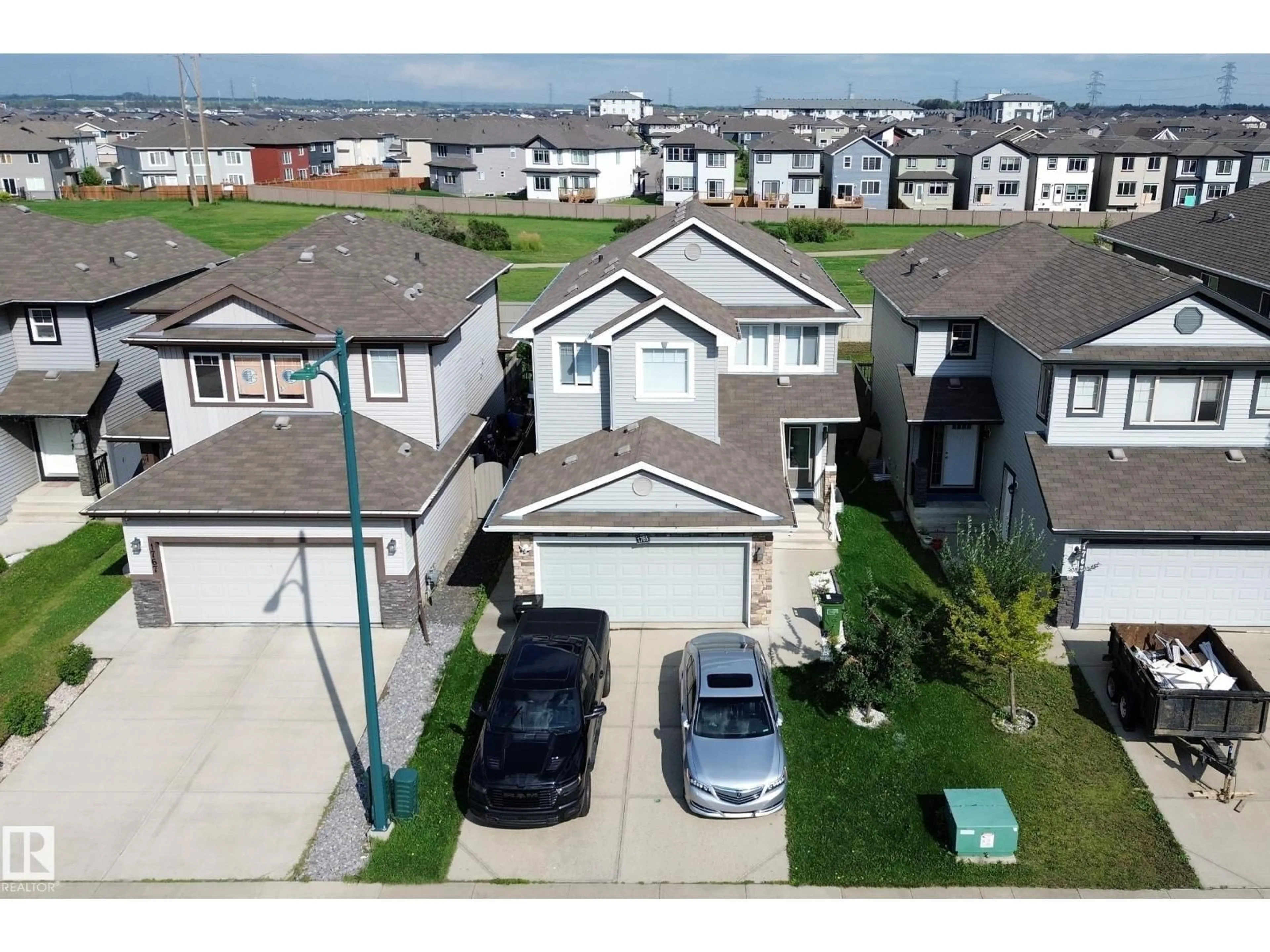 A pic from outside/outdoor area/front of a property/back of a property/a pic from drone, street for 1765 28 ST, Edmonton Alberta T6T0R6