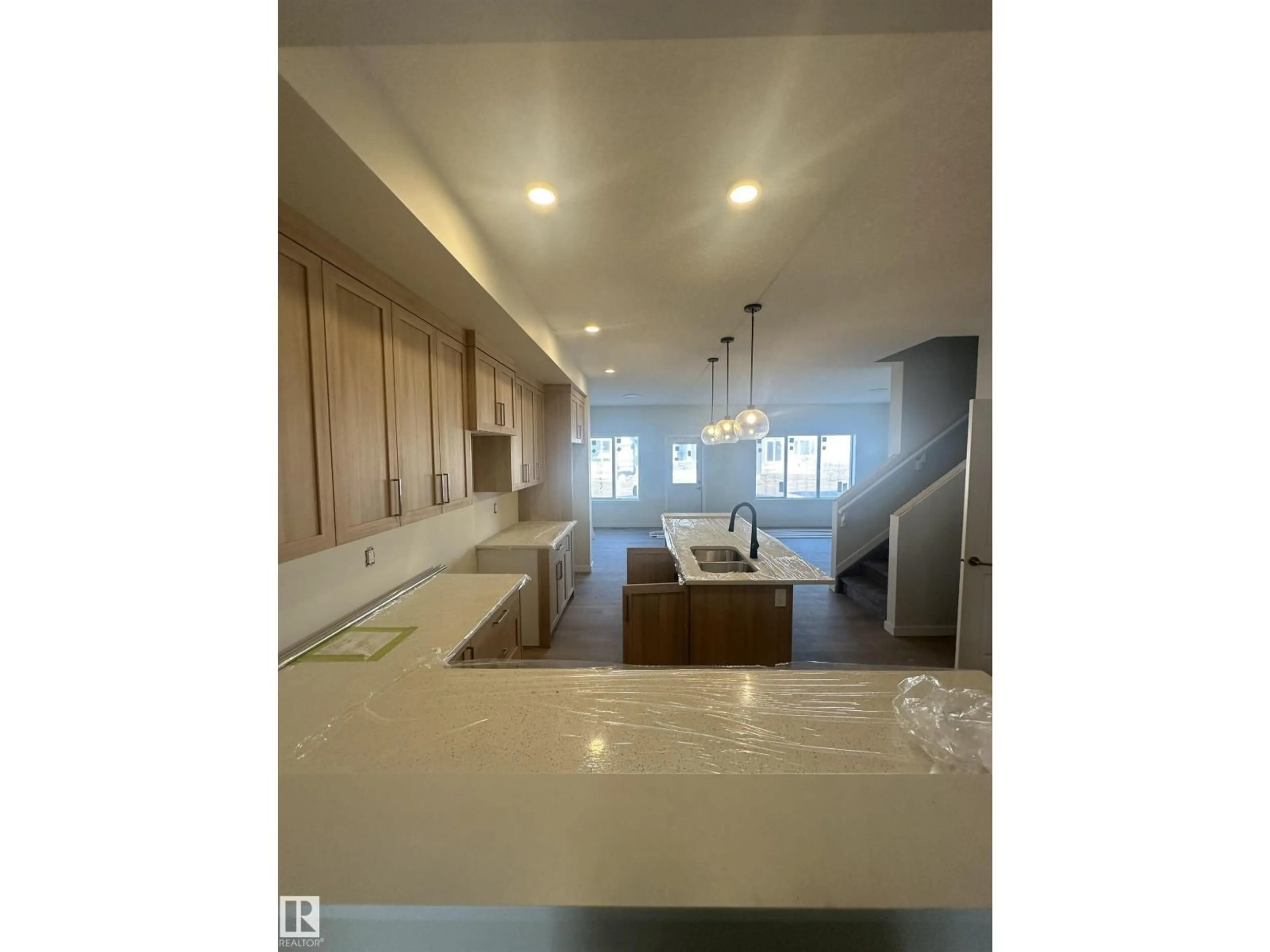 Open concept kitchen, unknown for 9104 ELVES LO, Edmonton Alberta T6M3G2