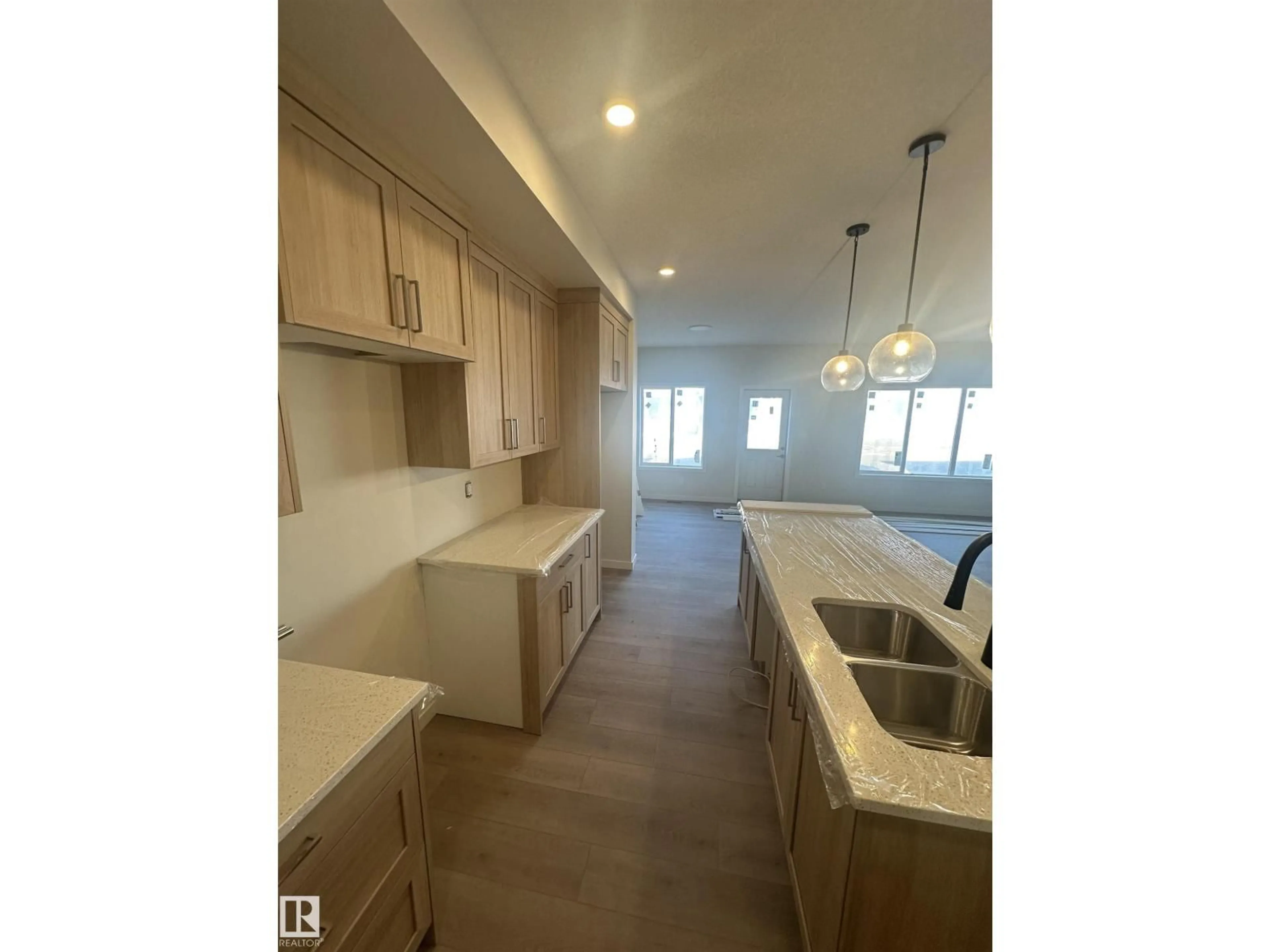 Open concept kitchen, unknown for 9104 ELVES LO, Edmonton Alberta T6M3G2