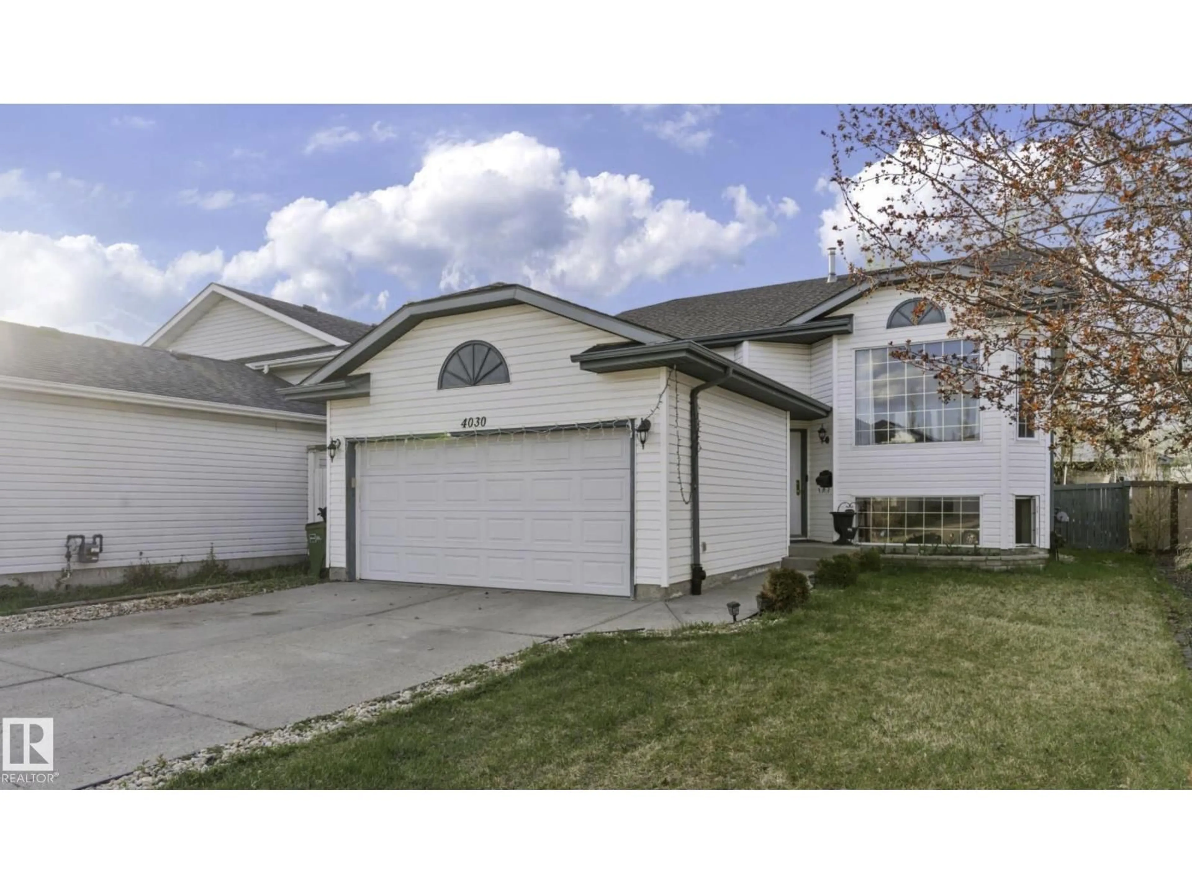Home with vinyl exterior material, street for NW - 4030 37A AVENUE, Edmonton Alberta T6L7A1